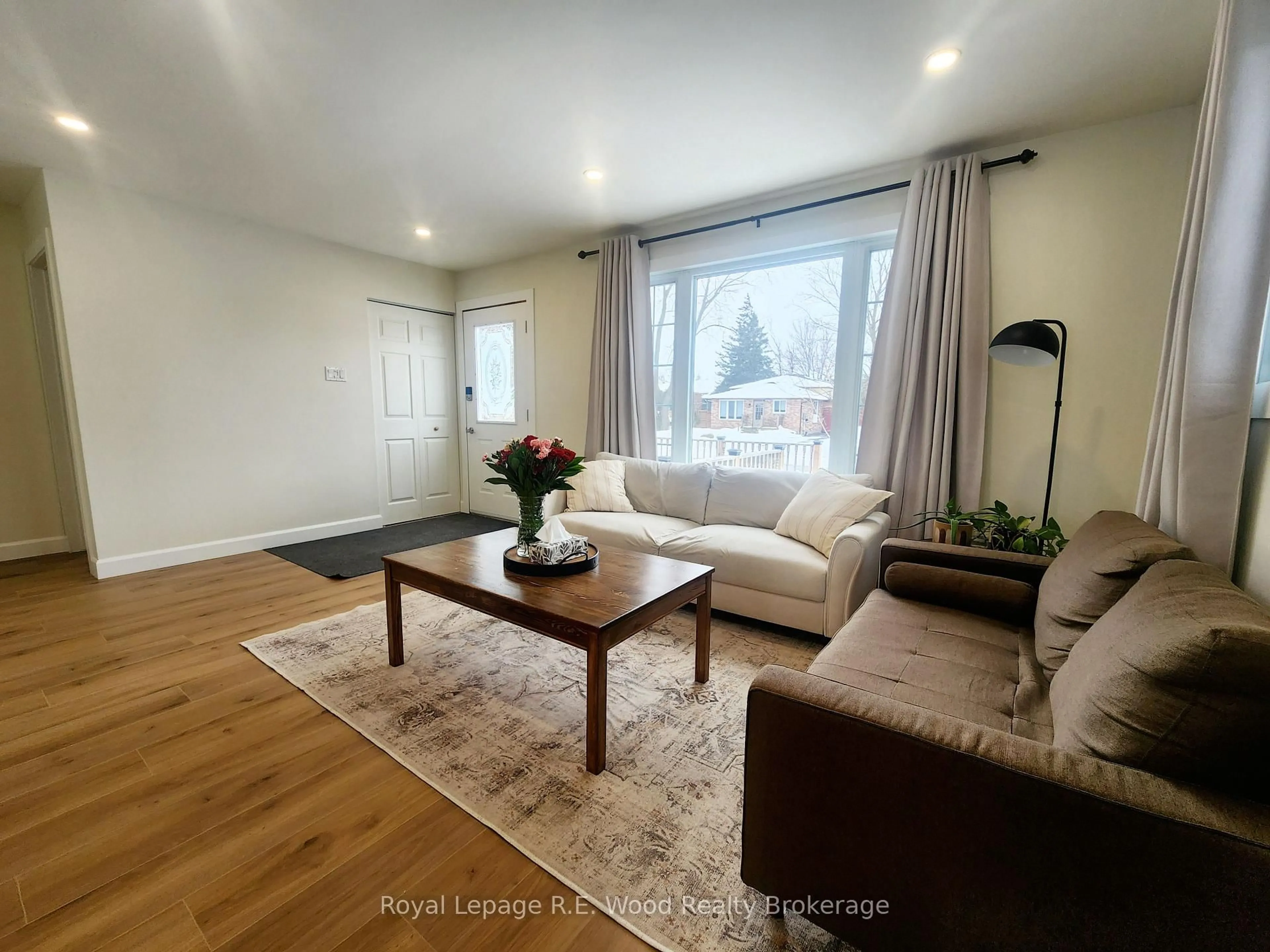 Living room with furniture, wood/laminate floor for 6 Centennial Ave, Tillsonburg Ontario N4G 4R6