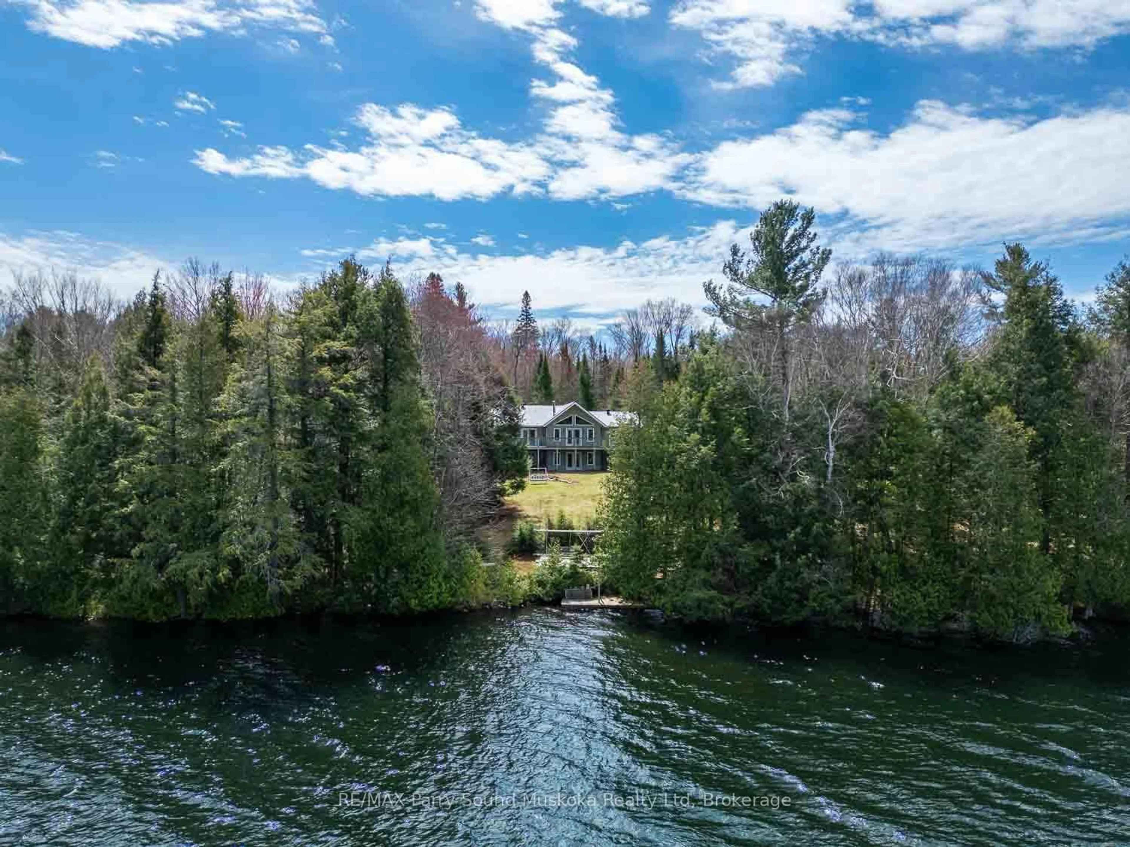 A pic from outside/outdoor area/front of a property/back of a property/a pic from drone, water/lake/river/ocean view for 1889 South Horn Lake Rd, Magnetawan Ontario P0A 1P0