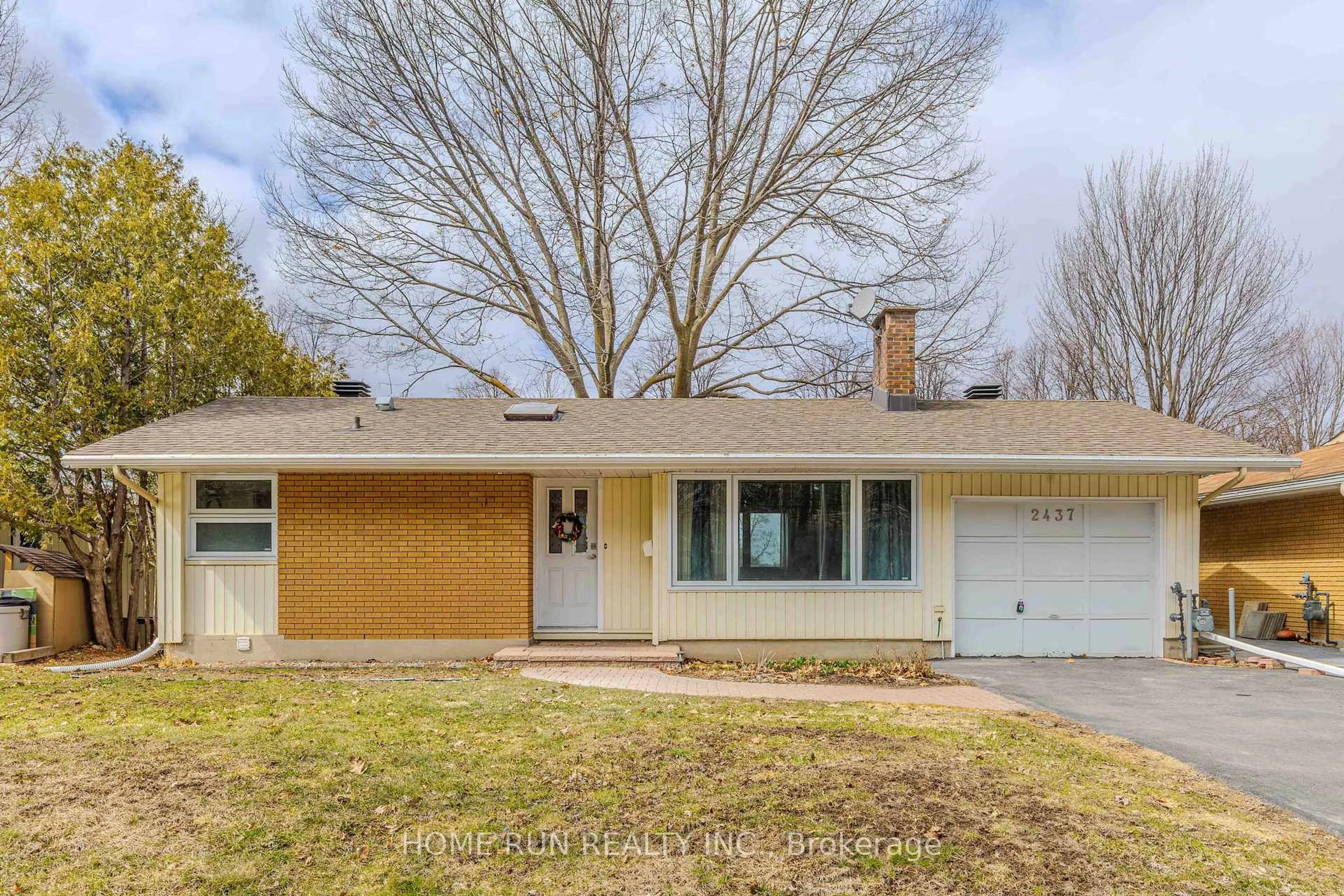 Home with vinyl exterior material, street for 2437 Baseline Rd, Ottawa Ontario K2C 0E3