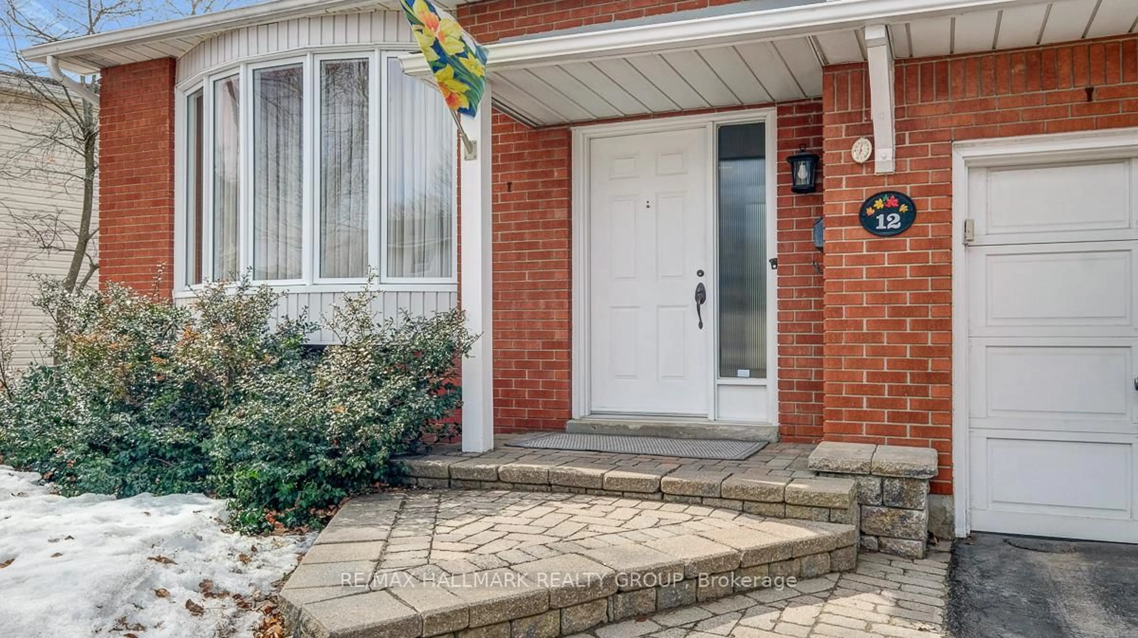 Home with brick exterior material, street for 12 Woodhill Cres, Ottawa Ontario K1B 3B6