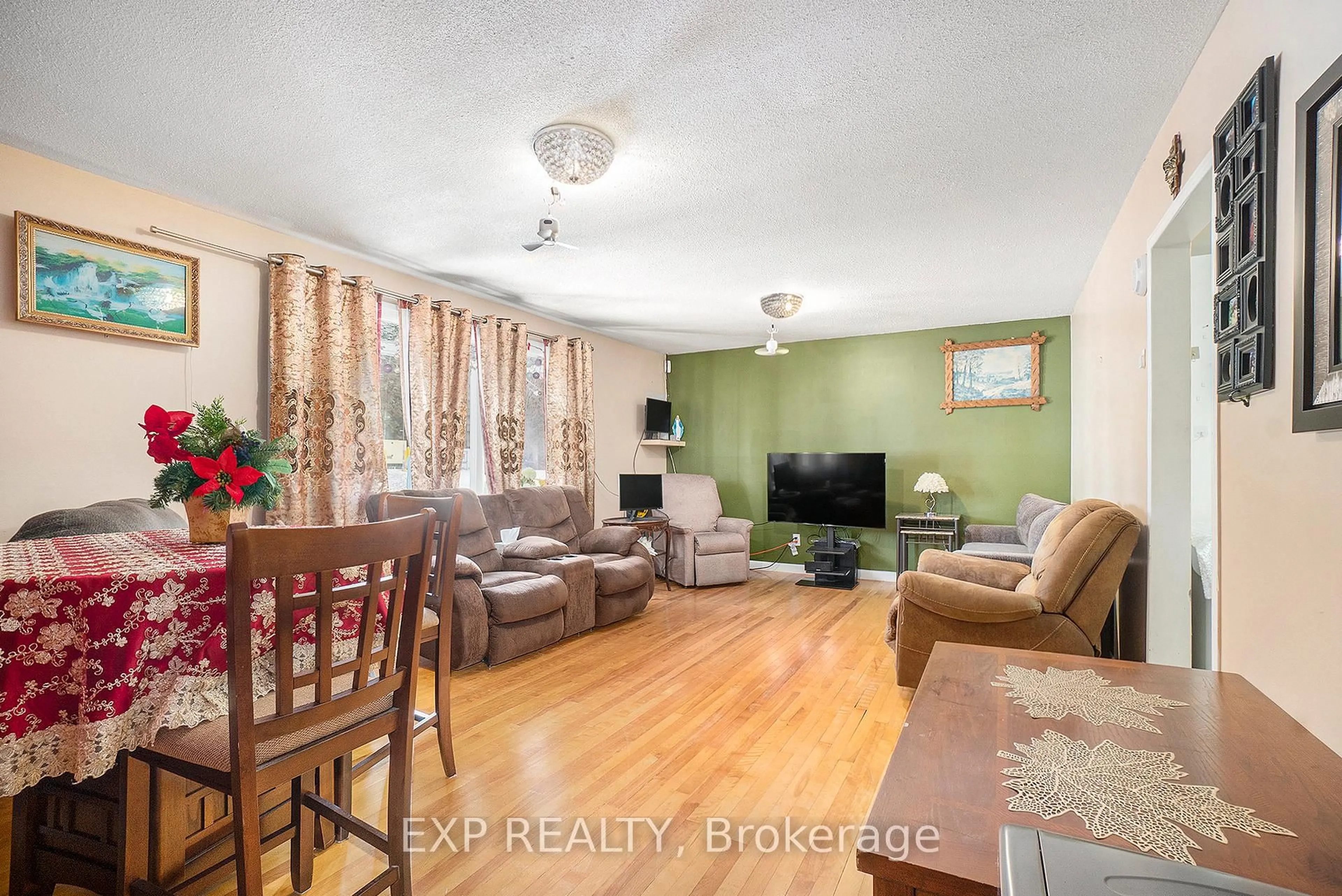 Living room with furniture, wood/laminate floor for 2024 Othello Ave, Ottawa Ontario K1G 2A6