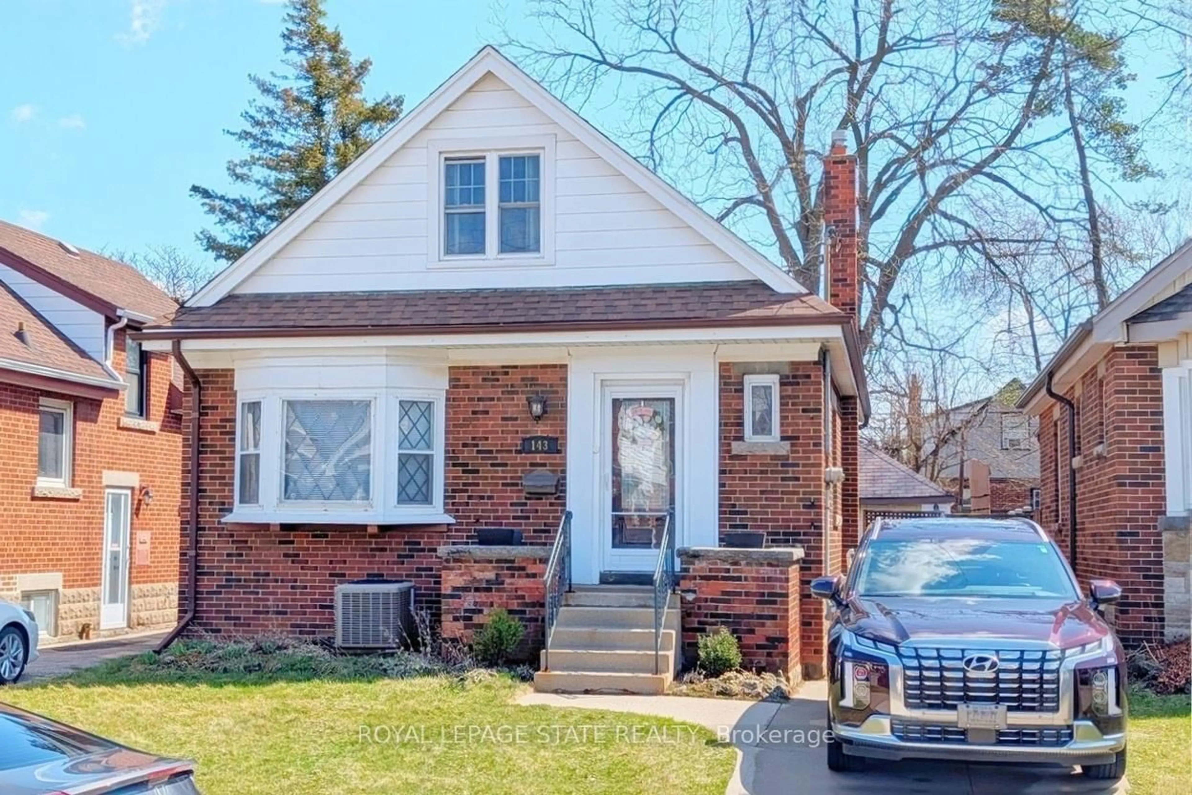 Home with brick exterior material, street for 143 Huxley Ave, Hamilton Ontario L8K 2P9