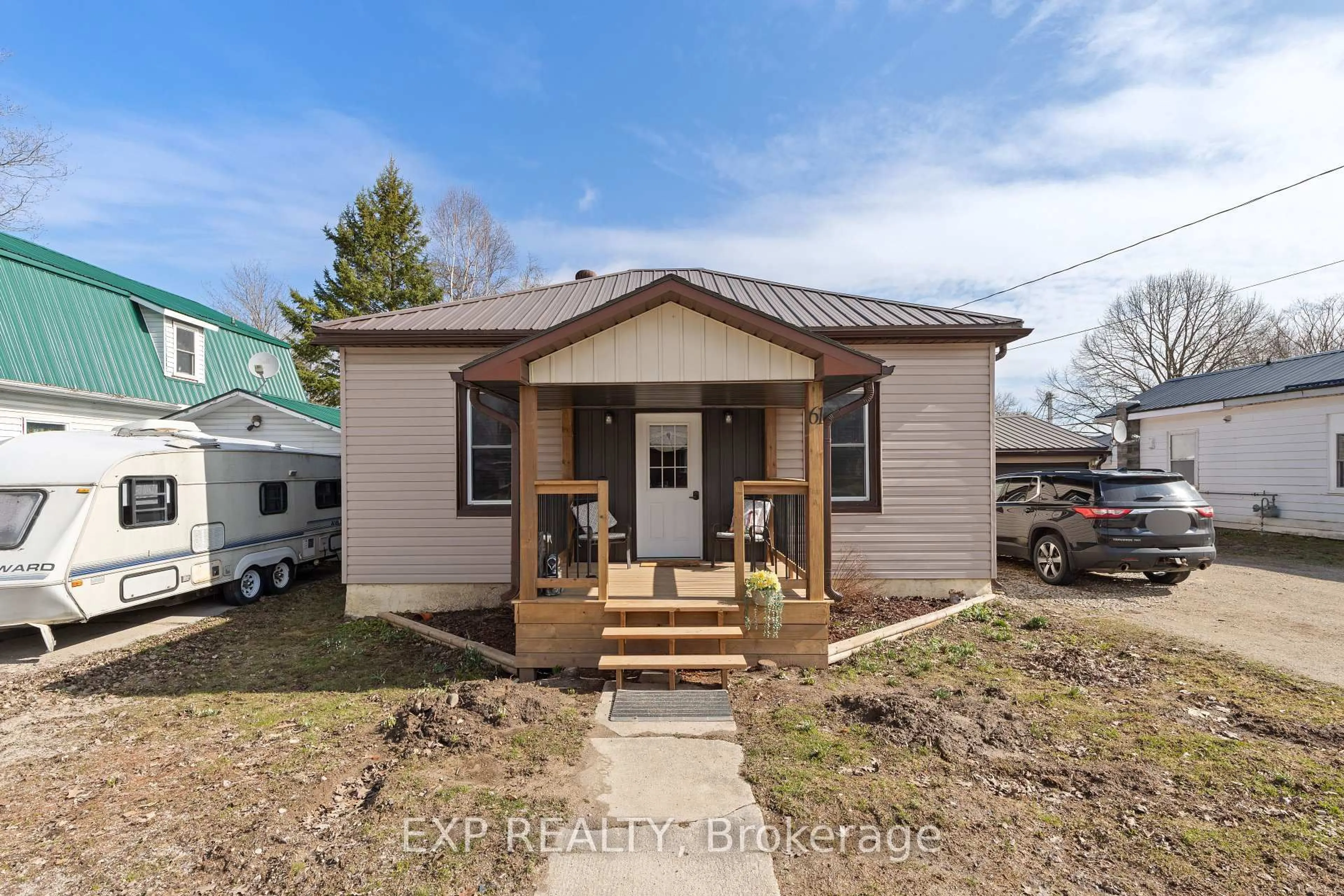 Home with vinyl exterior material, street for 61 Queen St, Huron East Ontario N0G 1H0