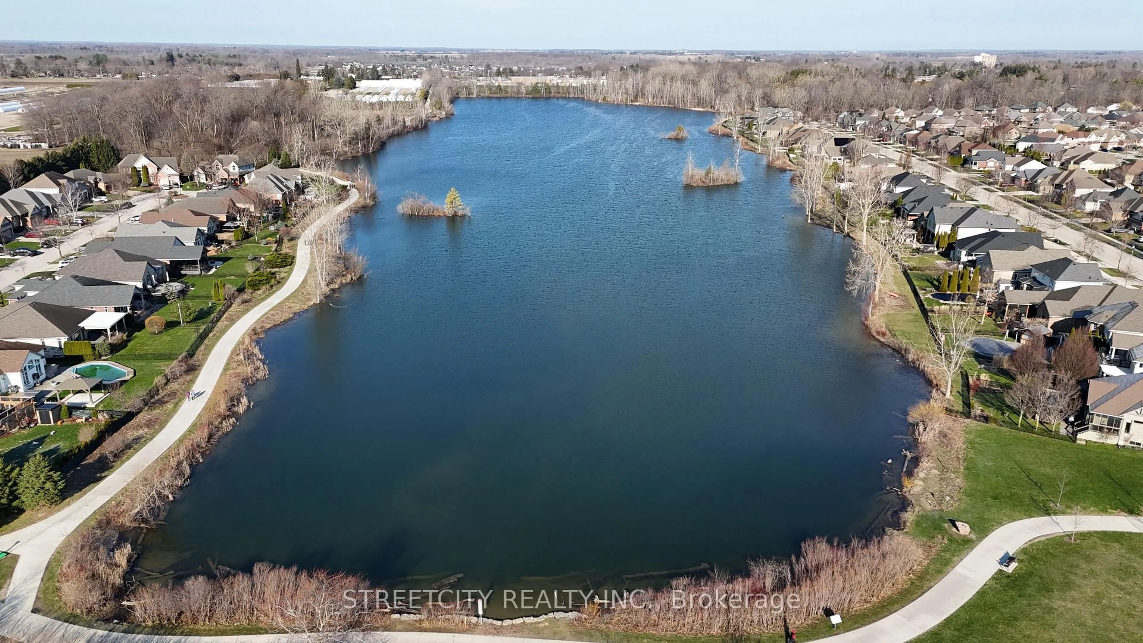 A pic from outside/outdoor area/front of a property/back of a property/a pic from drone, water/lake/river/ocean view for 26 Lake Margaret Tr, St. Thomas Ontario N5R 6K7