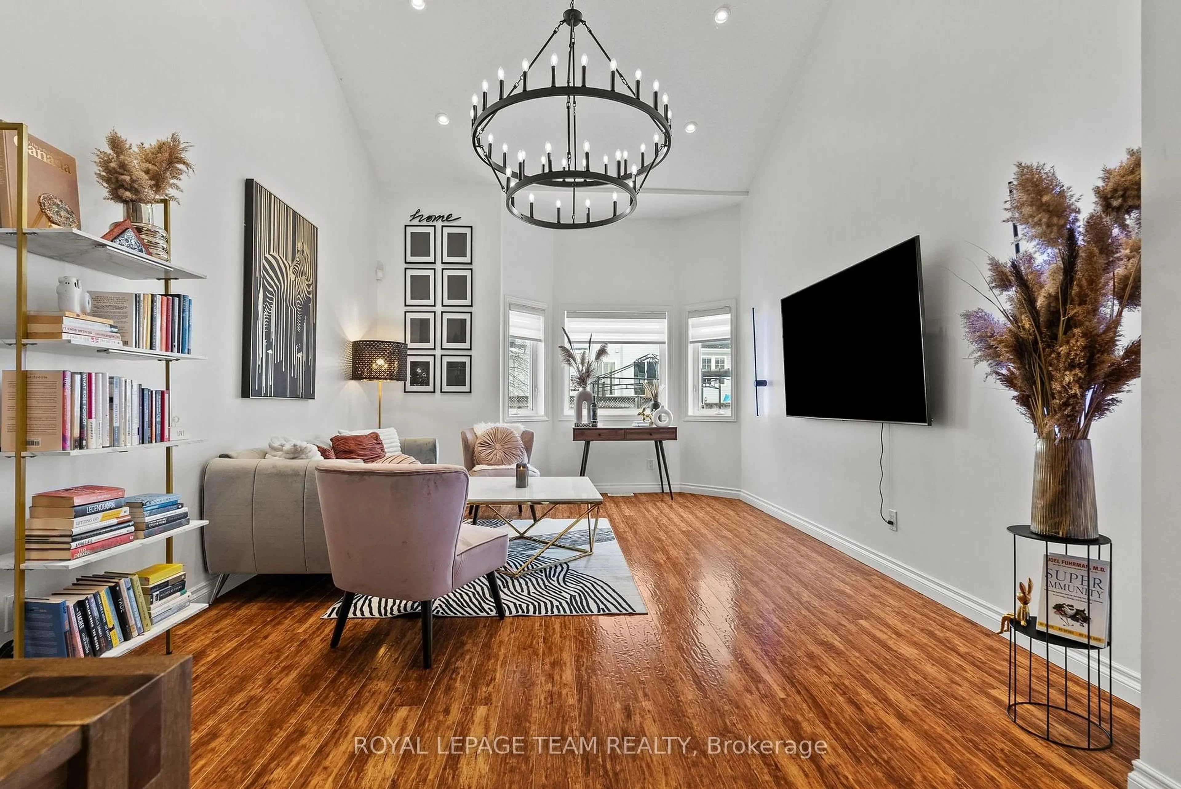 Living room with furniture, wood/laminate floor for 5 Milner Downs Cres, Ottawa Ontario K2M 2S6