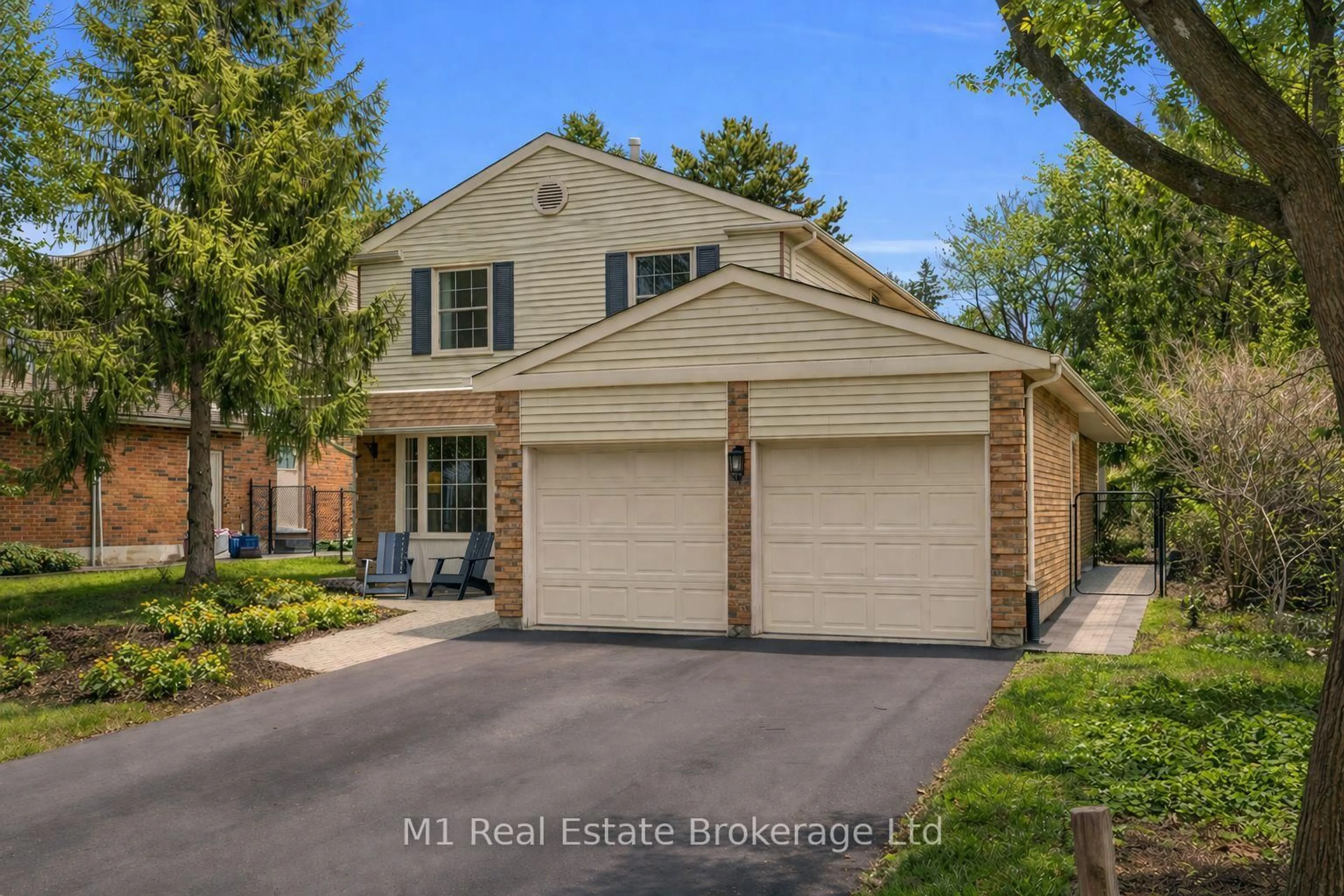 Home with brick exterior material, street for 320 Tatlock Dr, Waterloo Ontario N2L 5Y5