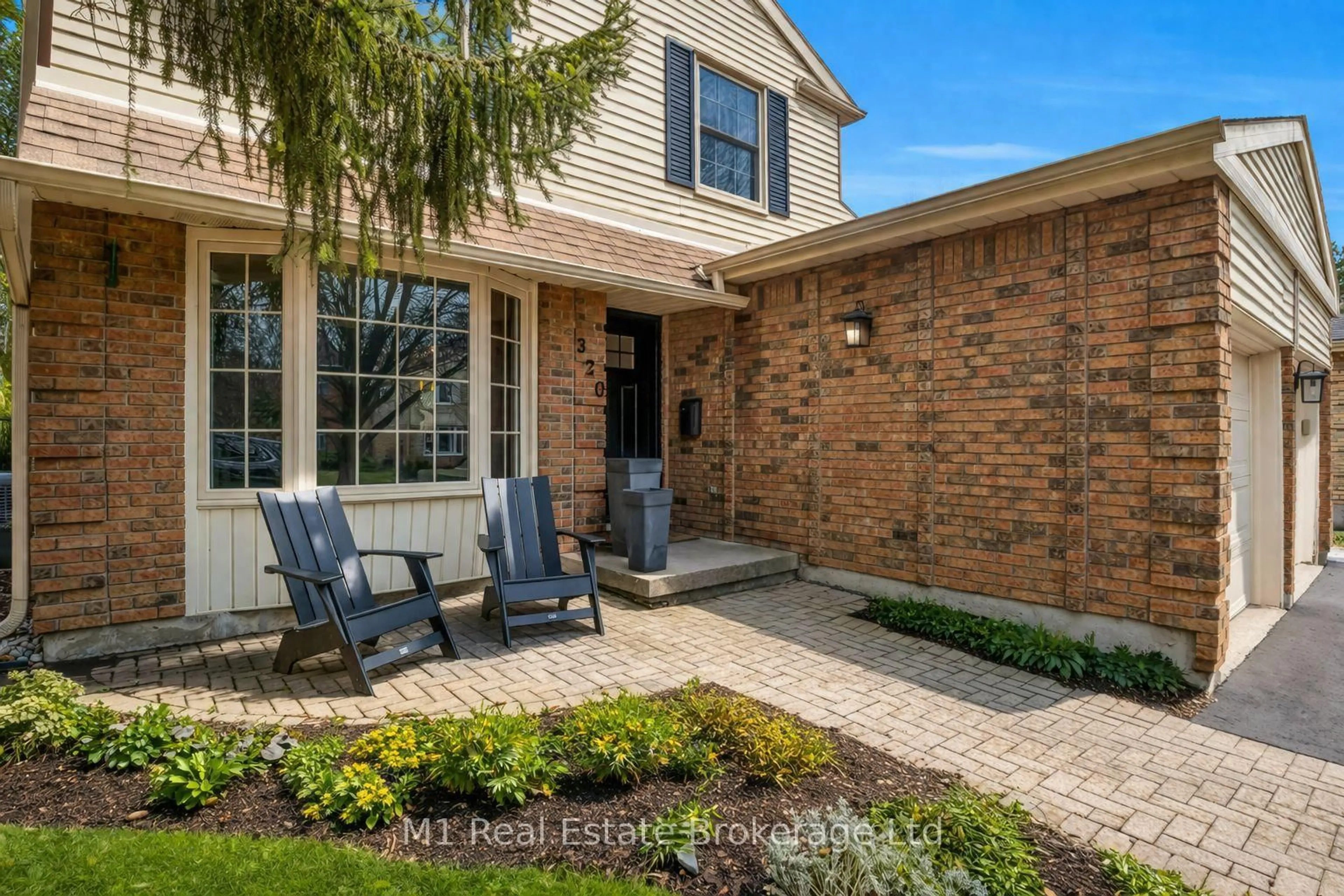 Home with brick exterior material, street for 320 Tatlock Dr, Waterloo Ontario N2L 5Y5