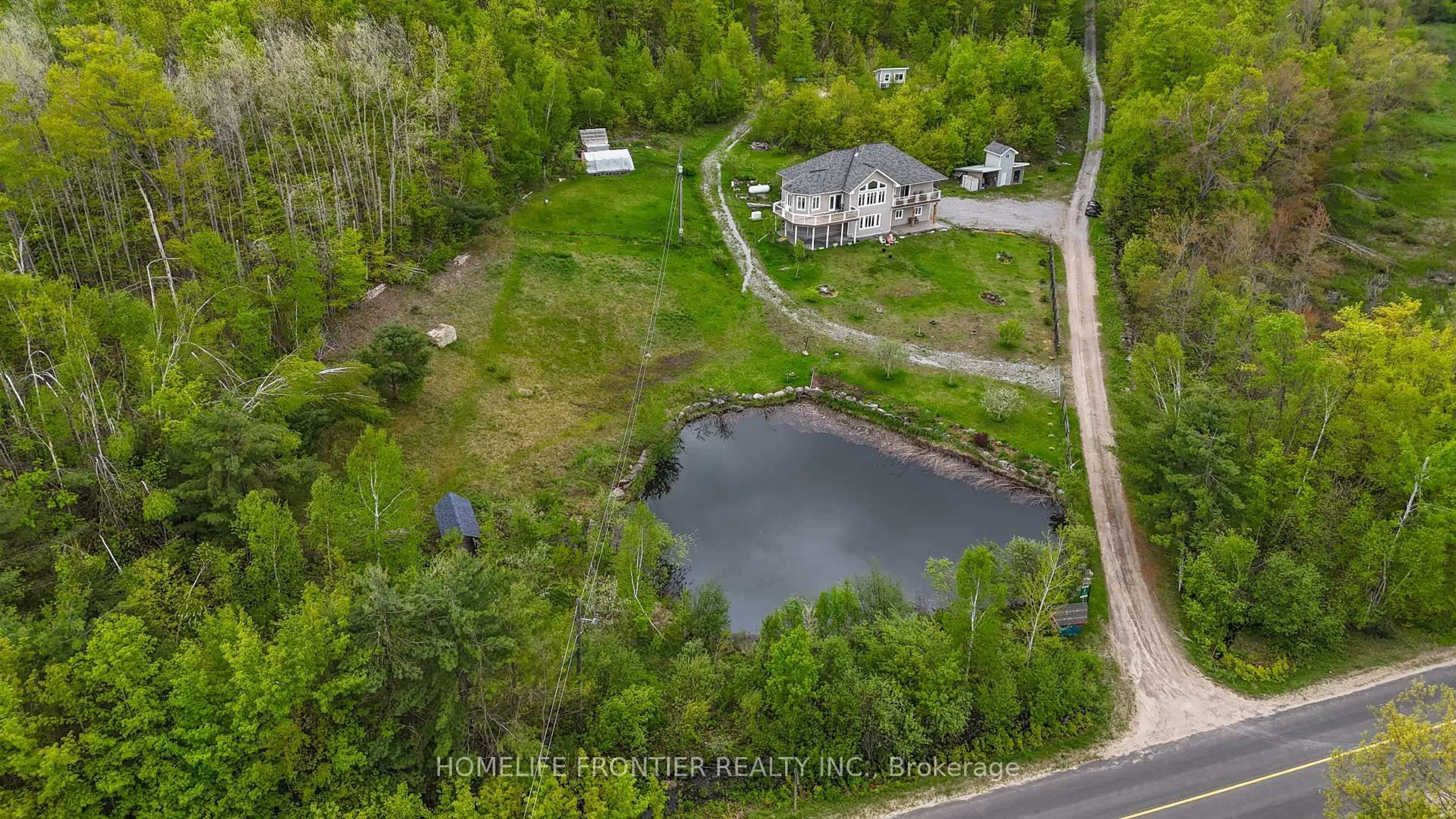 A pic from outside/outdoor area/front of a property/back of a property/a pic from drone, water/lake/river/ocean view for 1019 Silk Lane, Minden Hills Ontario K0M 2K0