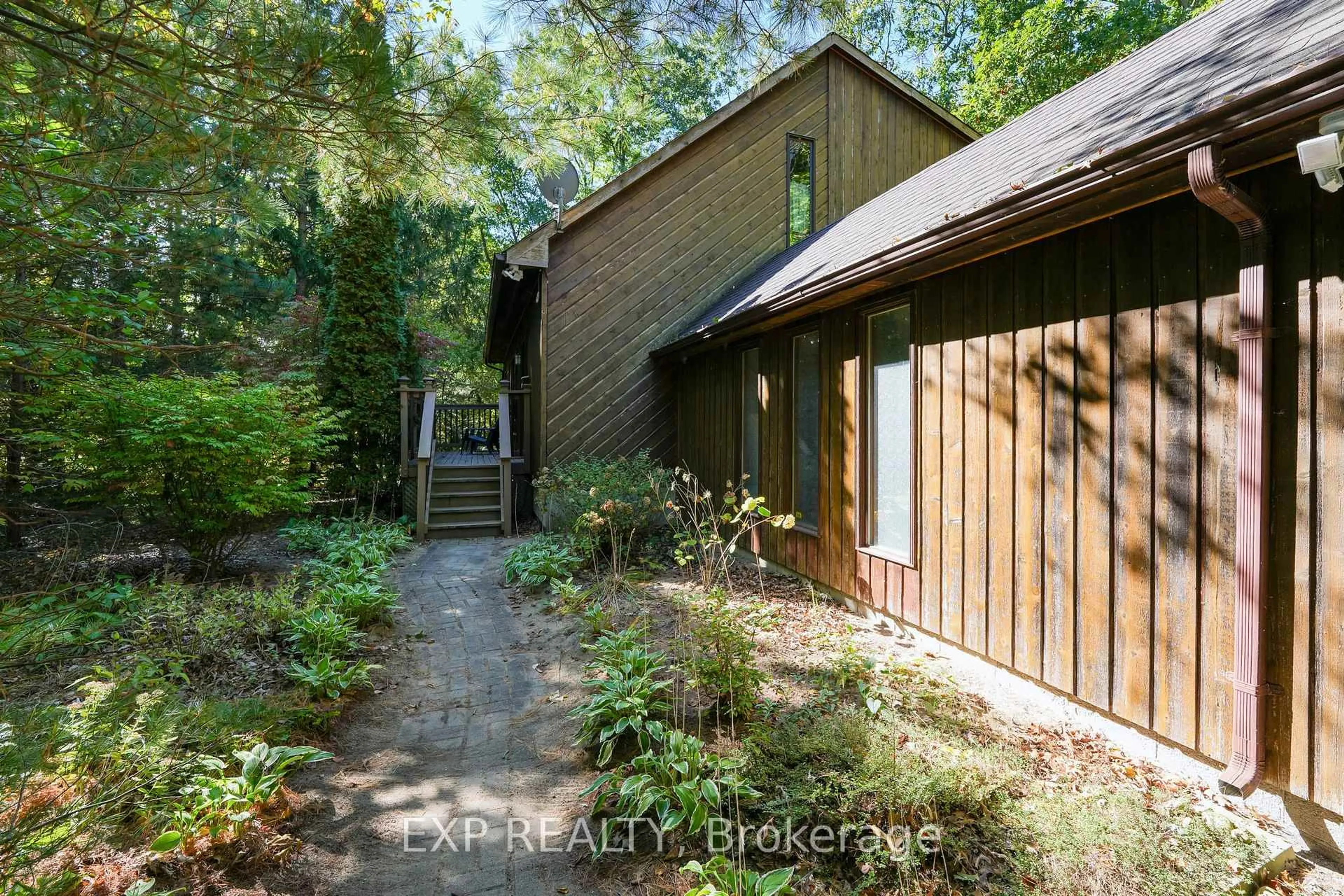 A pic from outside/outdoor area/front of a property/back of a property/a pic from drone, forest/trees view for 10207 Pinetree Dr, Lambton Shores Ontario N0M 1T0