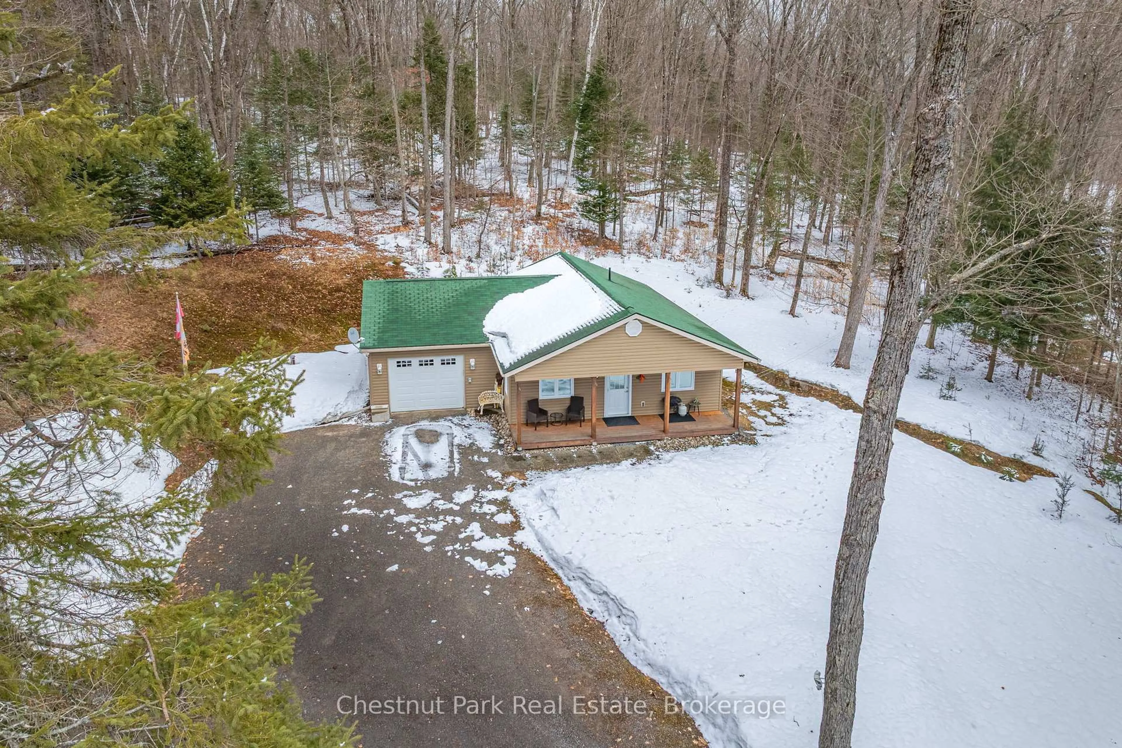 A pic from outside/outdoor area/front of a property/back of a property/a pic from drone, forest/trees view for 85 Line Hill Rd, Huntsville Ontario P1H 2N5