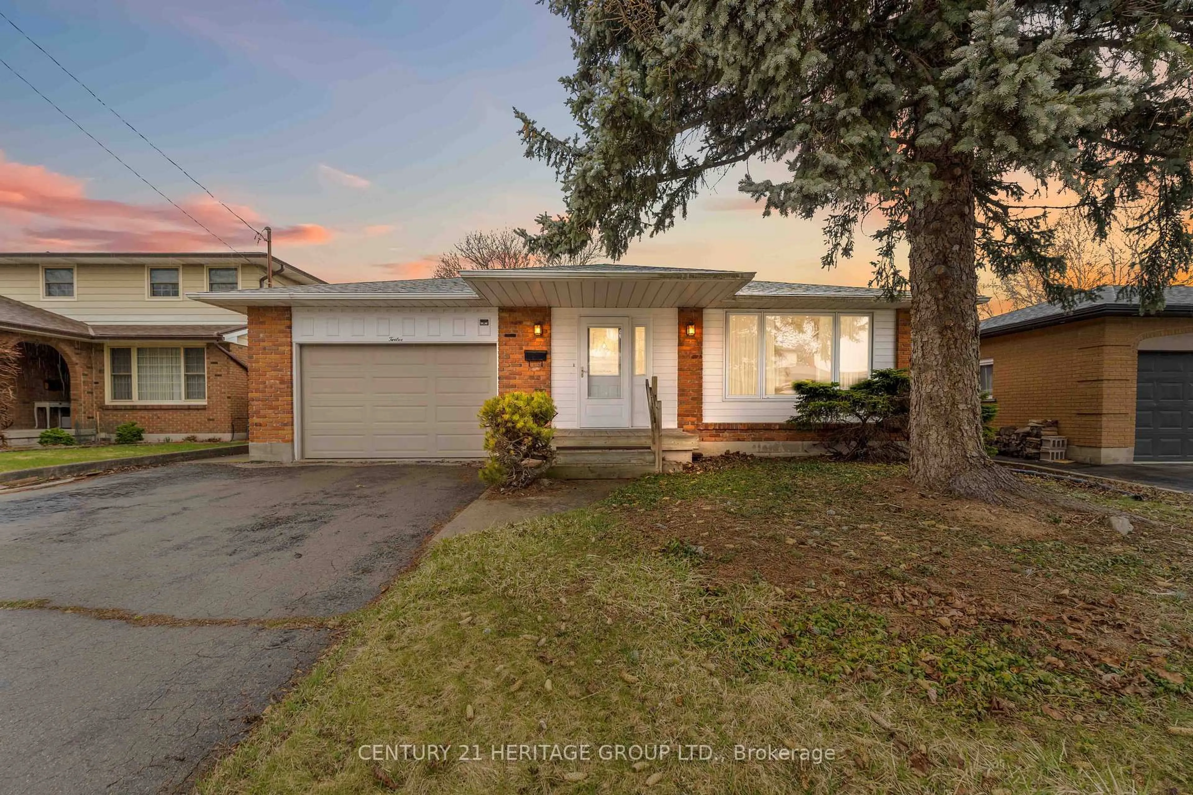 Home with brick exterior material, street for 12 Roland Rd, Hamilton Ontario L9B 1S6