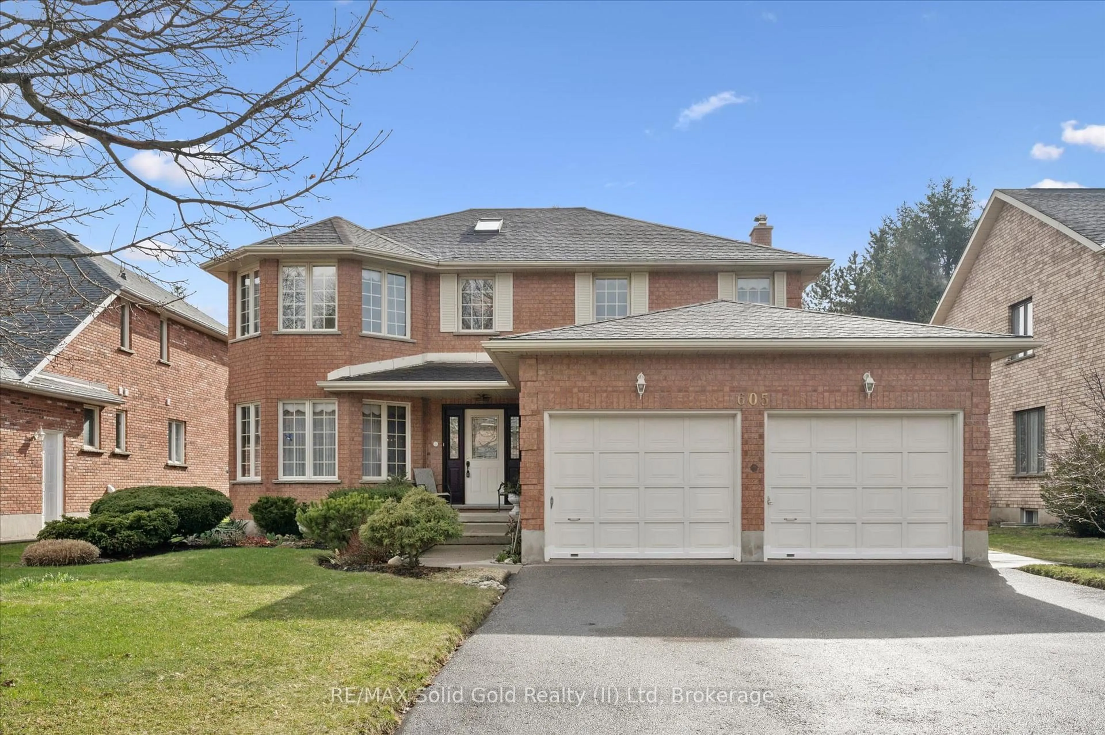 Home with brick exterior material, street for 605 Stonebury Cres, Waterloo Ontario N2K 3R2