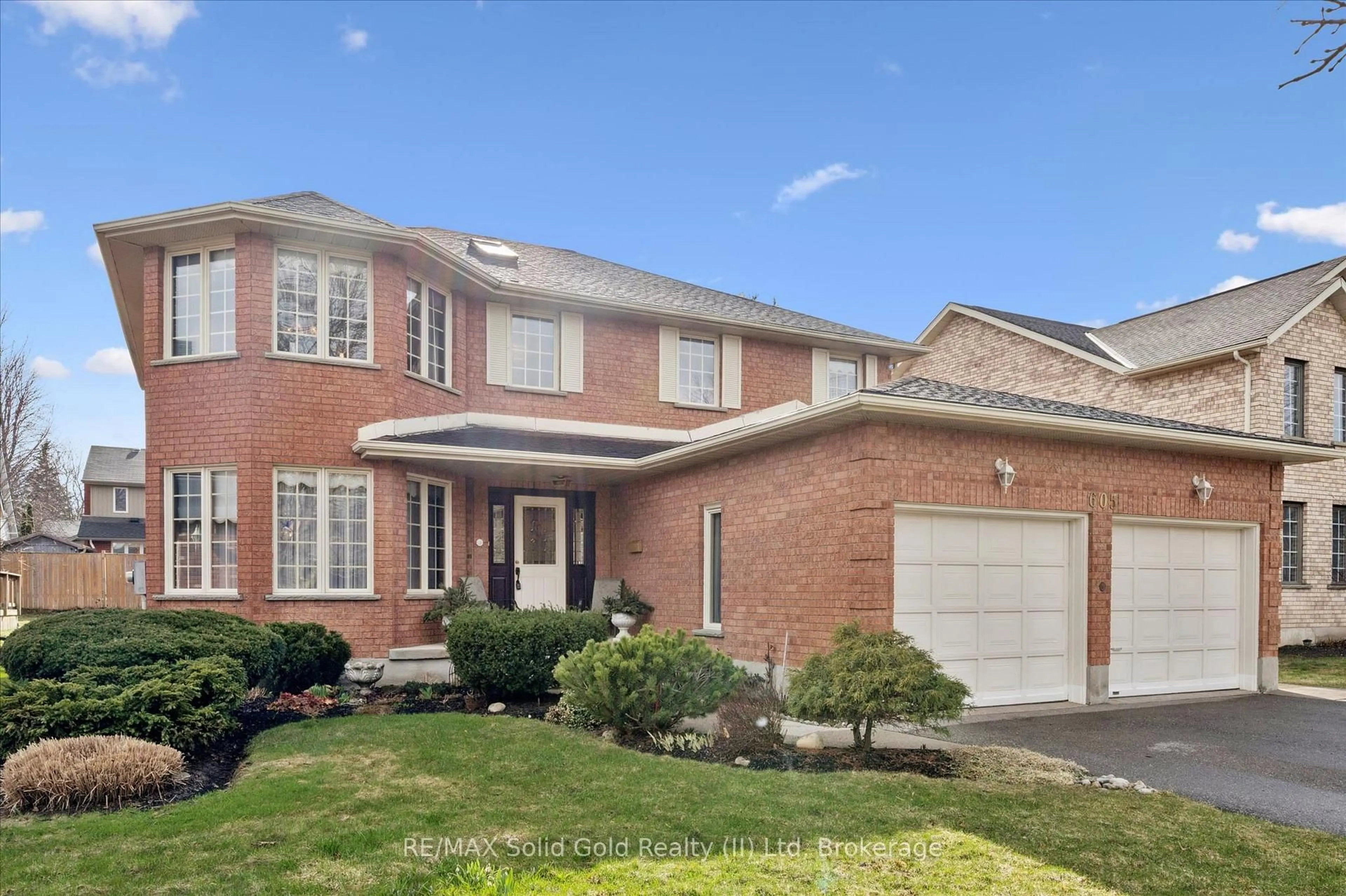 Home with brick exterior material, street for 605 Stonebury Cres, Waterloo Ontario N2K 3R2