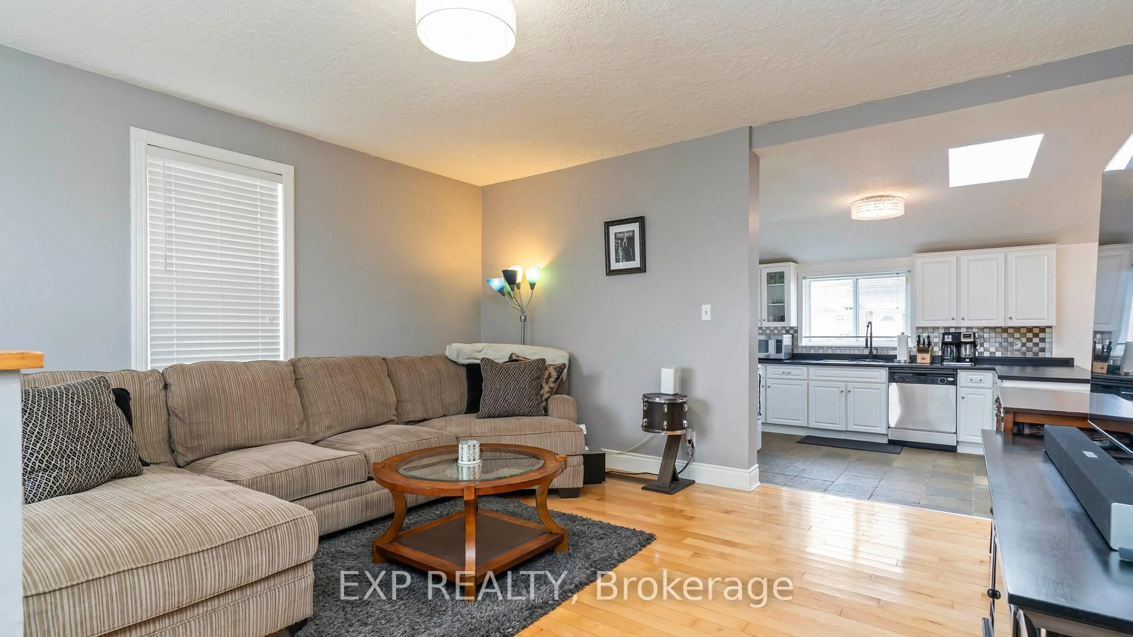 Living room with furniture, wood/laminate floor for 205 East St, London East Ontario N5Z 2S1