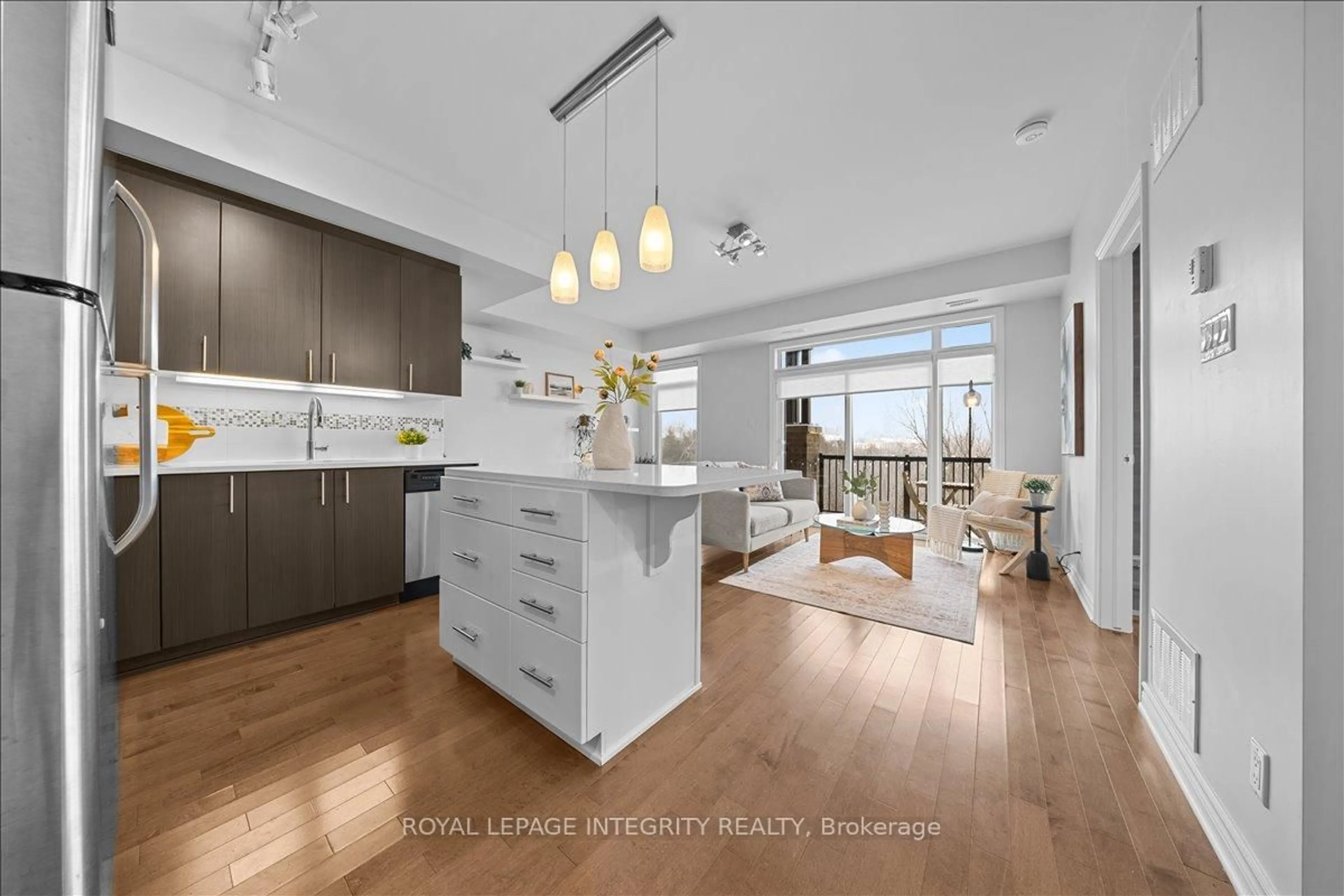 Open concept kitchen, wood/laminate floor for 705 Beauparc Private #303, Ottawa Ontario K1J 0B6