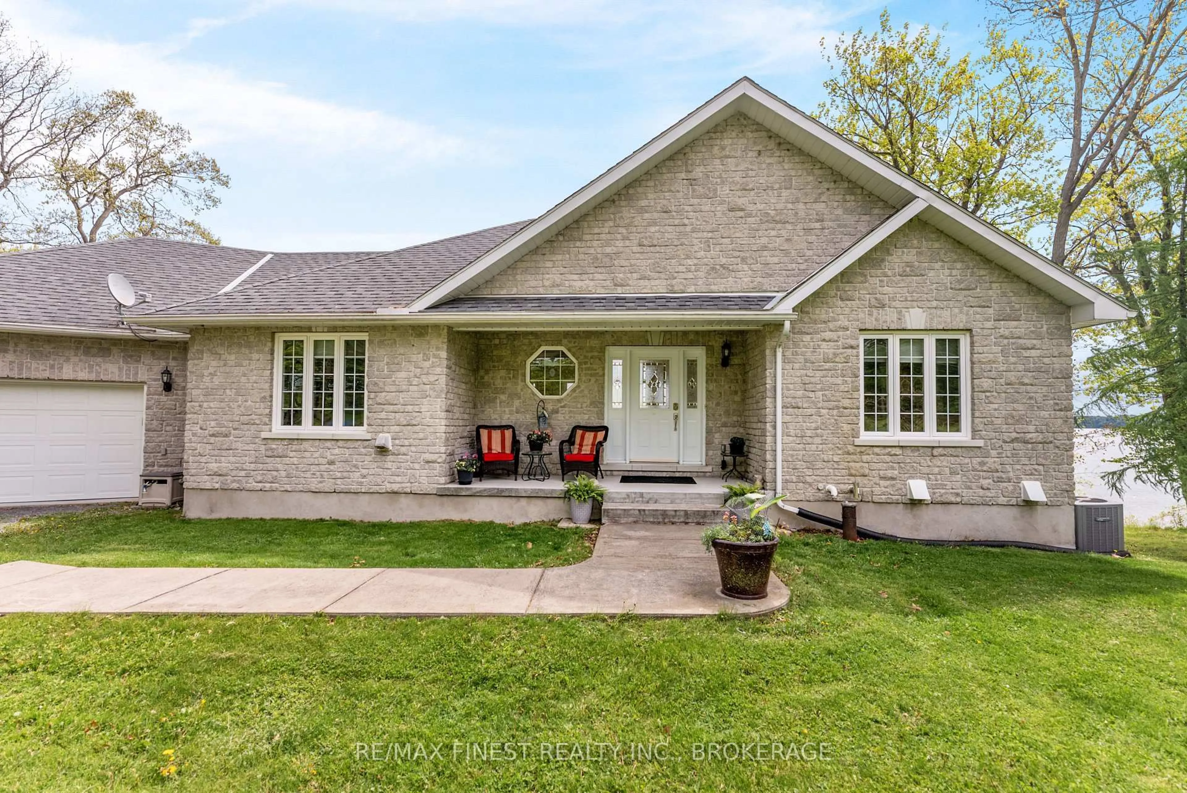 Home with brick exterior material, street for 121 Hickory Lane, Wolfe Island Ontario K0H 2Y0