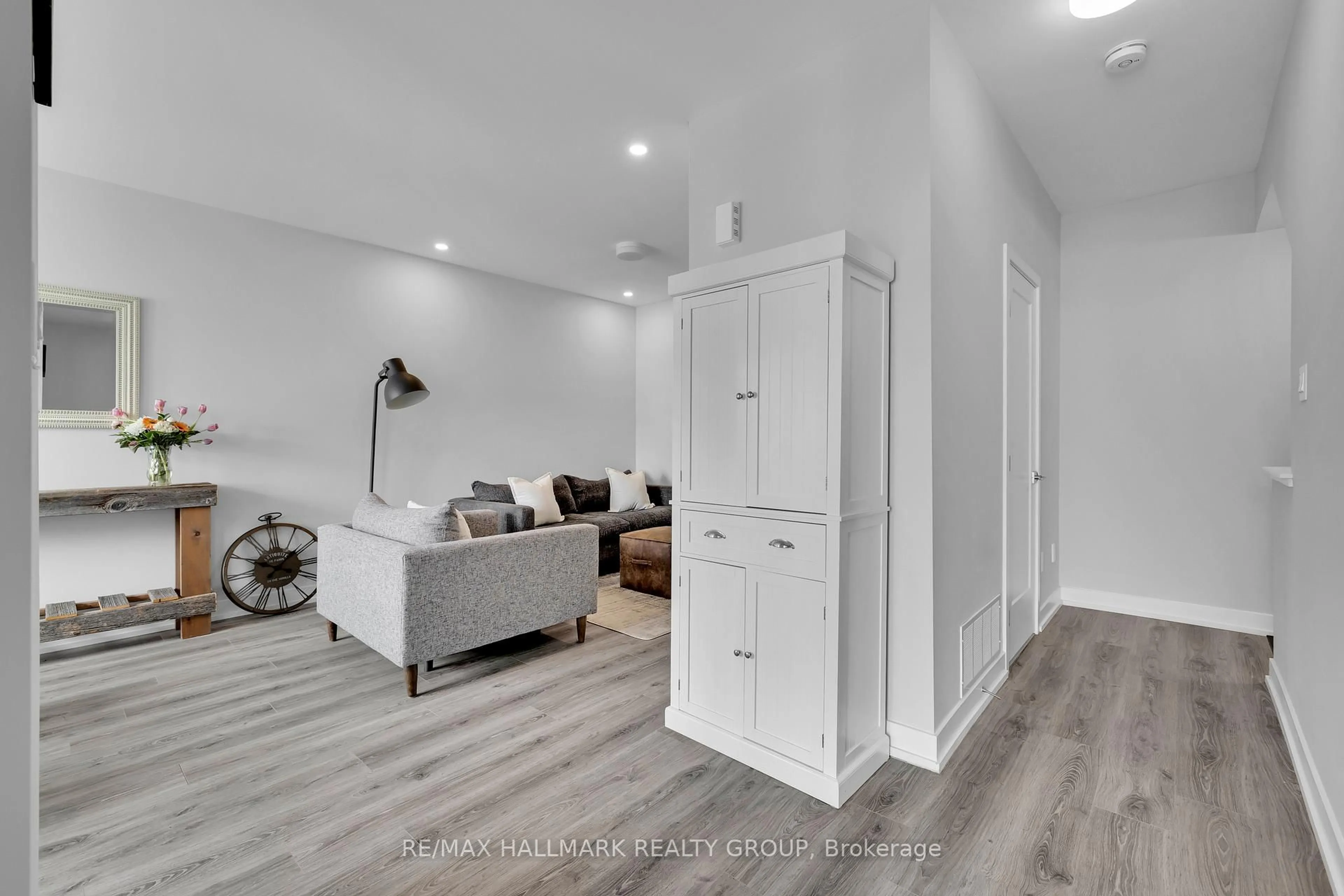 Living room with furniture, wood/laminate floor for 738 Chromite Private, Ottawa Ontario K2J 7J2