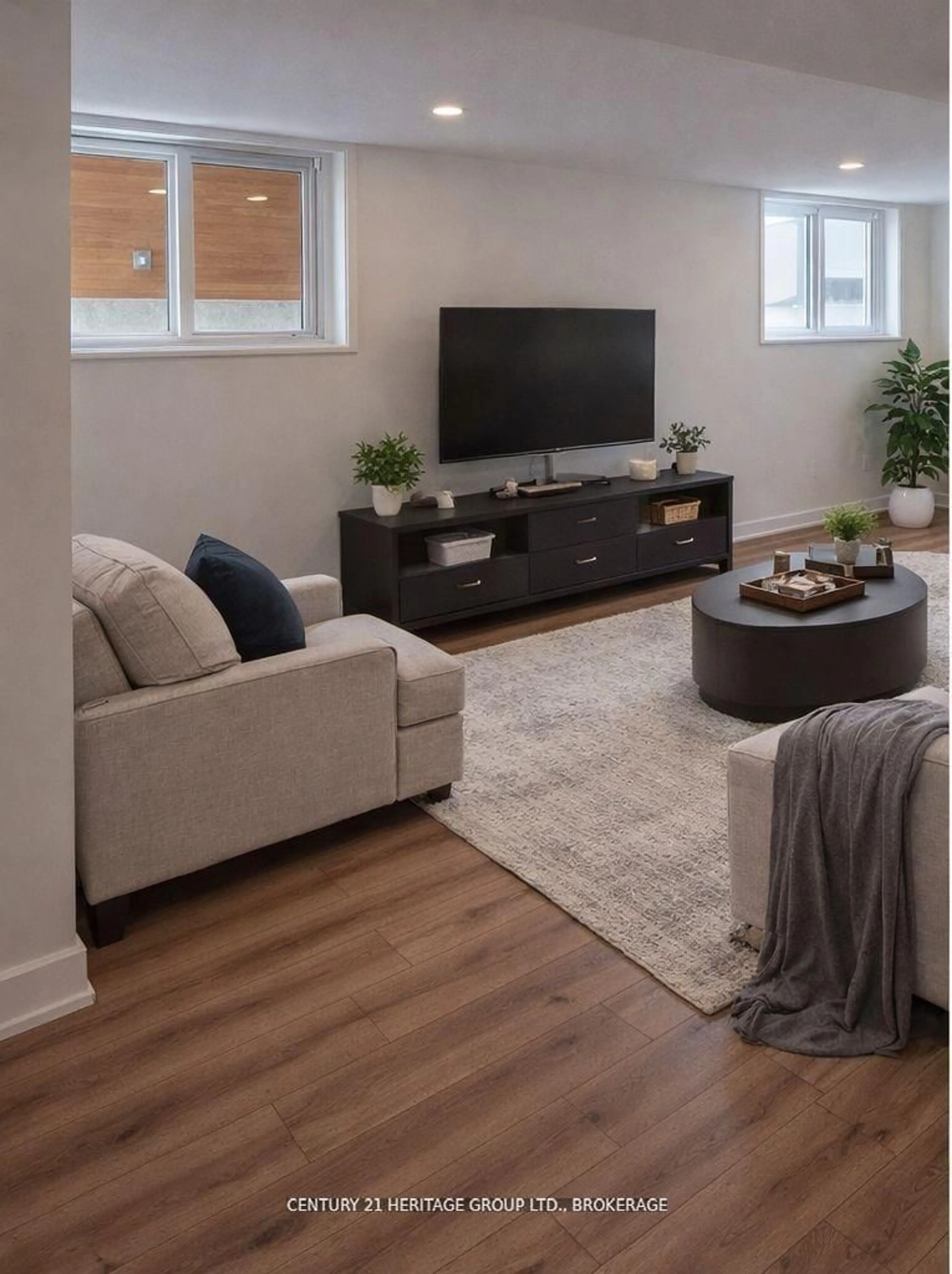 Living room with furniture, wood/laminate floor for 105 Creighton(lot 63) Dr, Newburgh Ontario K0K 2S0