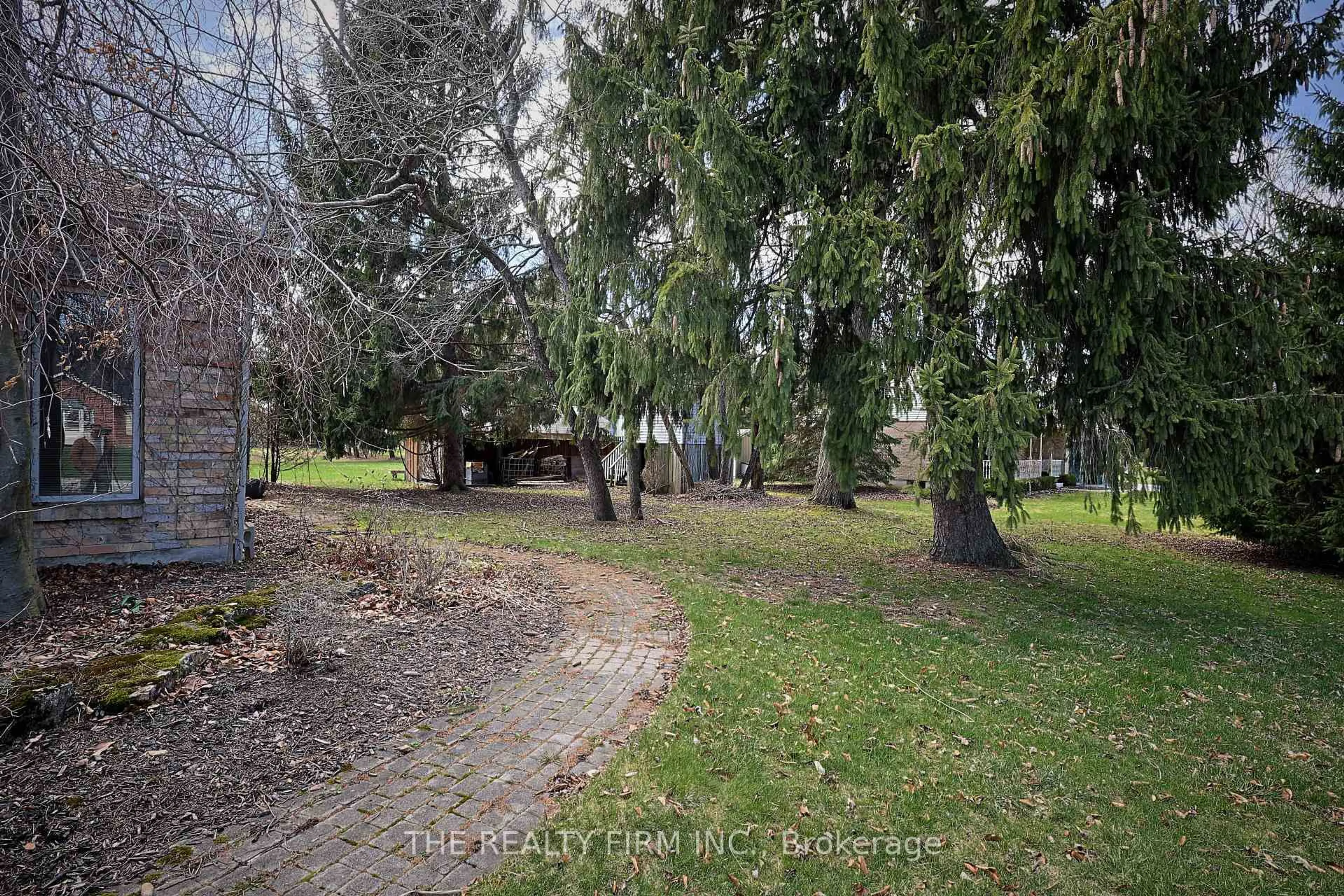 A pic from outside/outdoor area/front of a property/back of a property/a pic from drone, forest/trees view for 10308 Greenpark Rd, Southwold Ontario N5P 3T2