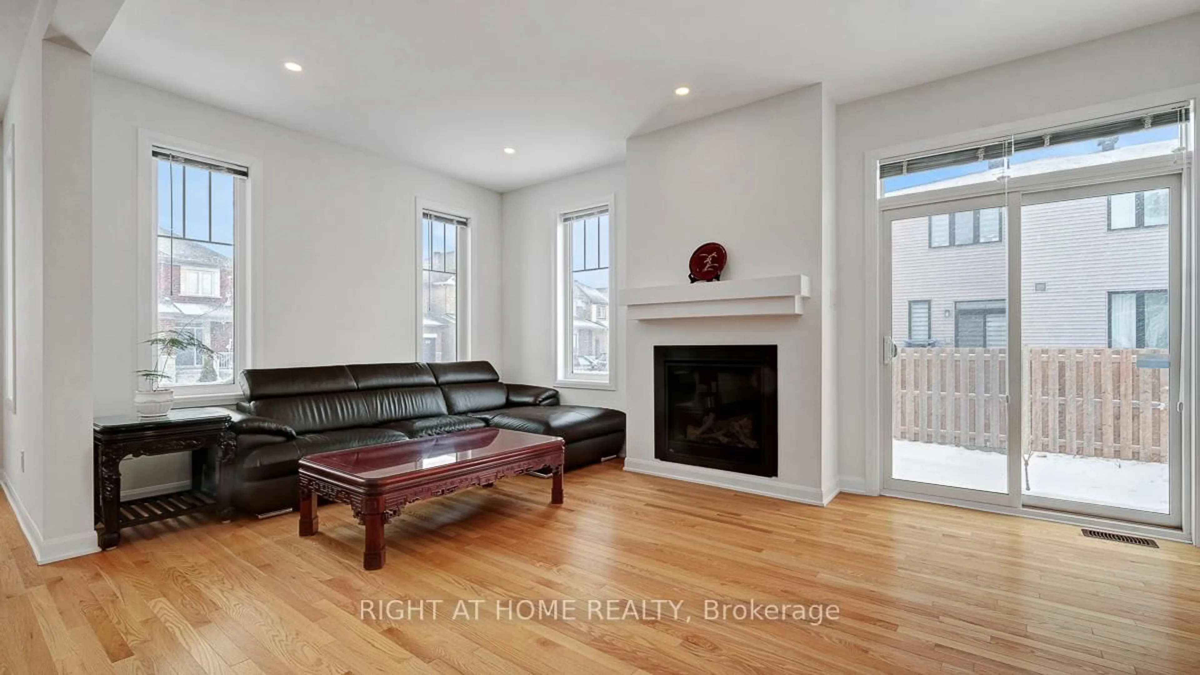 Living room with furniture, wood/laminate floor for 22 Dalkey Way, Ottawa Ontario K2J 6V5