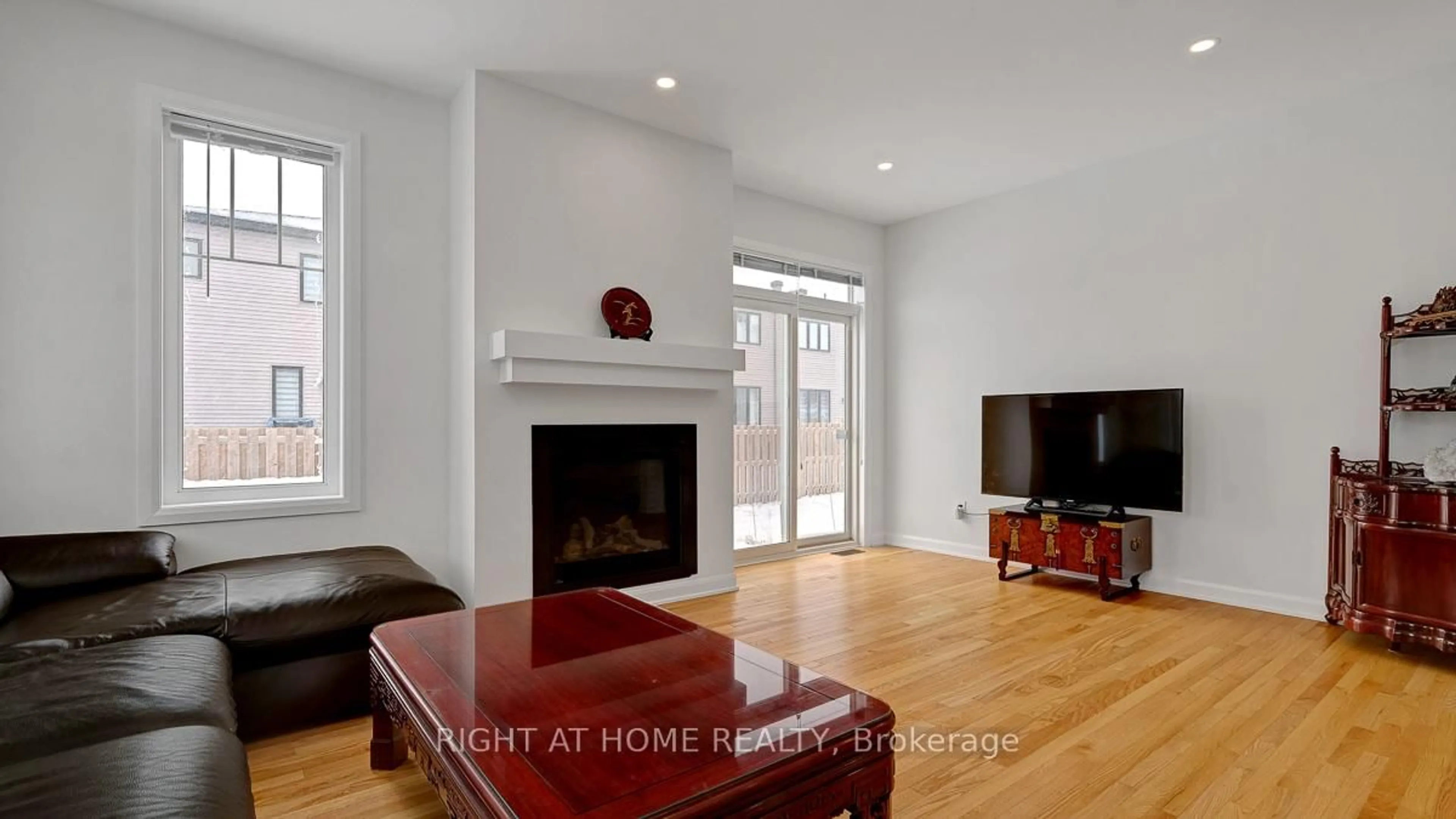 Living room with furniture, wood/laminate floor for 22 Dalkey Way, Ottawa Ontario K2J 6V5