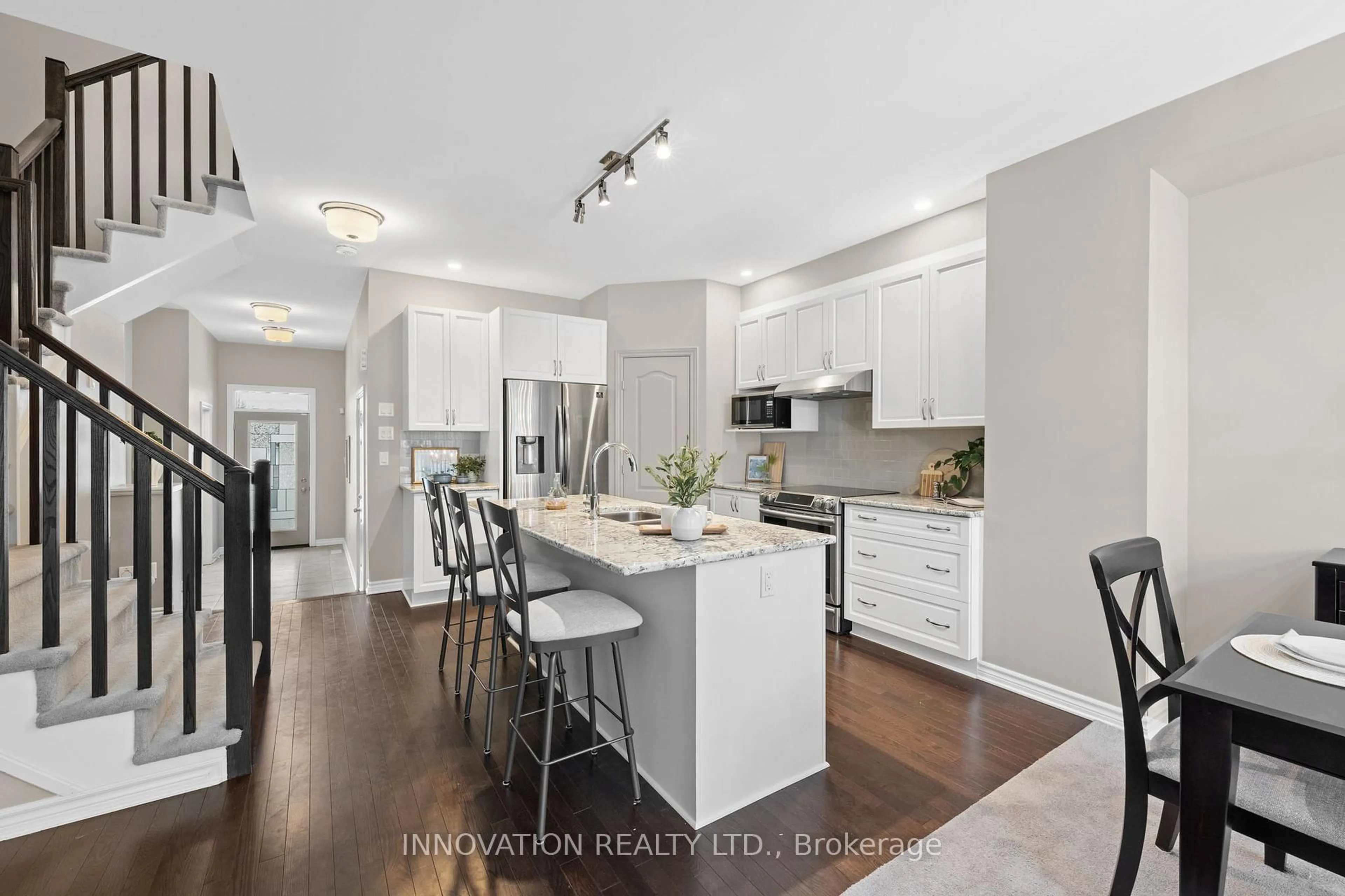 Open concept kitchen, wood/laminate floor for 13 Merrill St, Ottawa Ontario K2S 2M8
