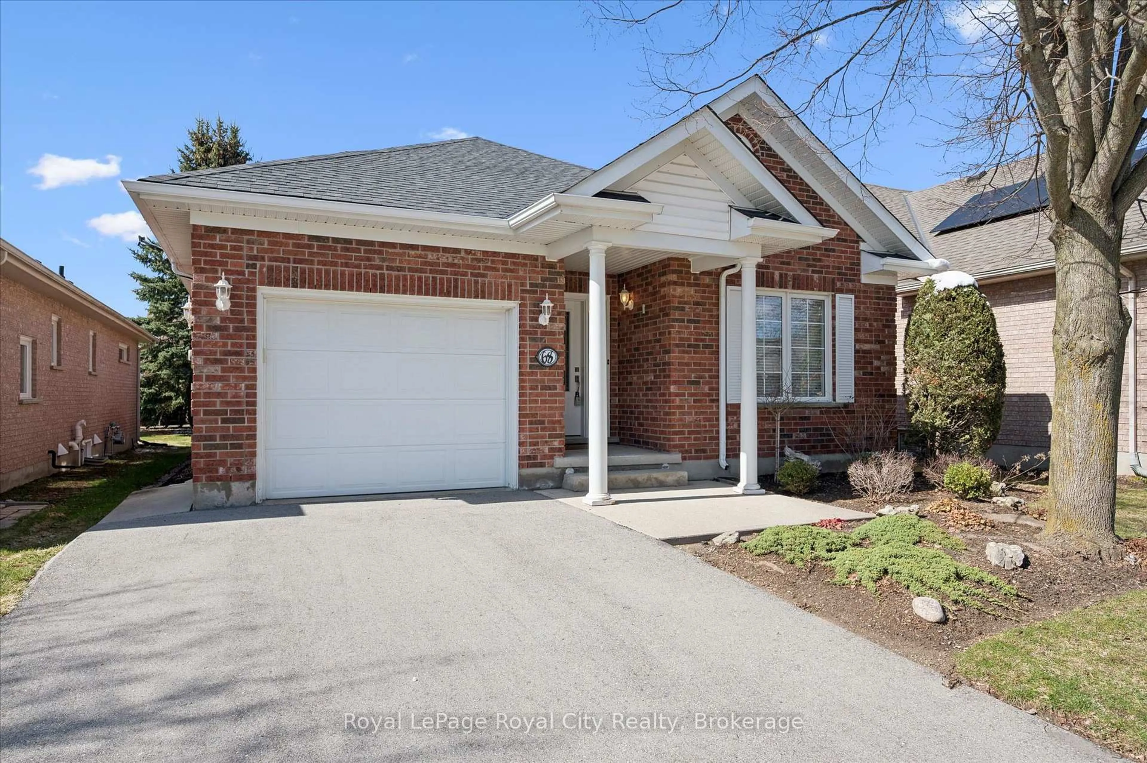 Home with brick exterior material, street for 68 Basswood Dr, Guelph Ontario N1G 4X7
