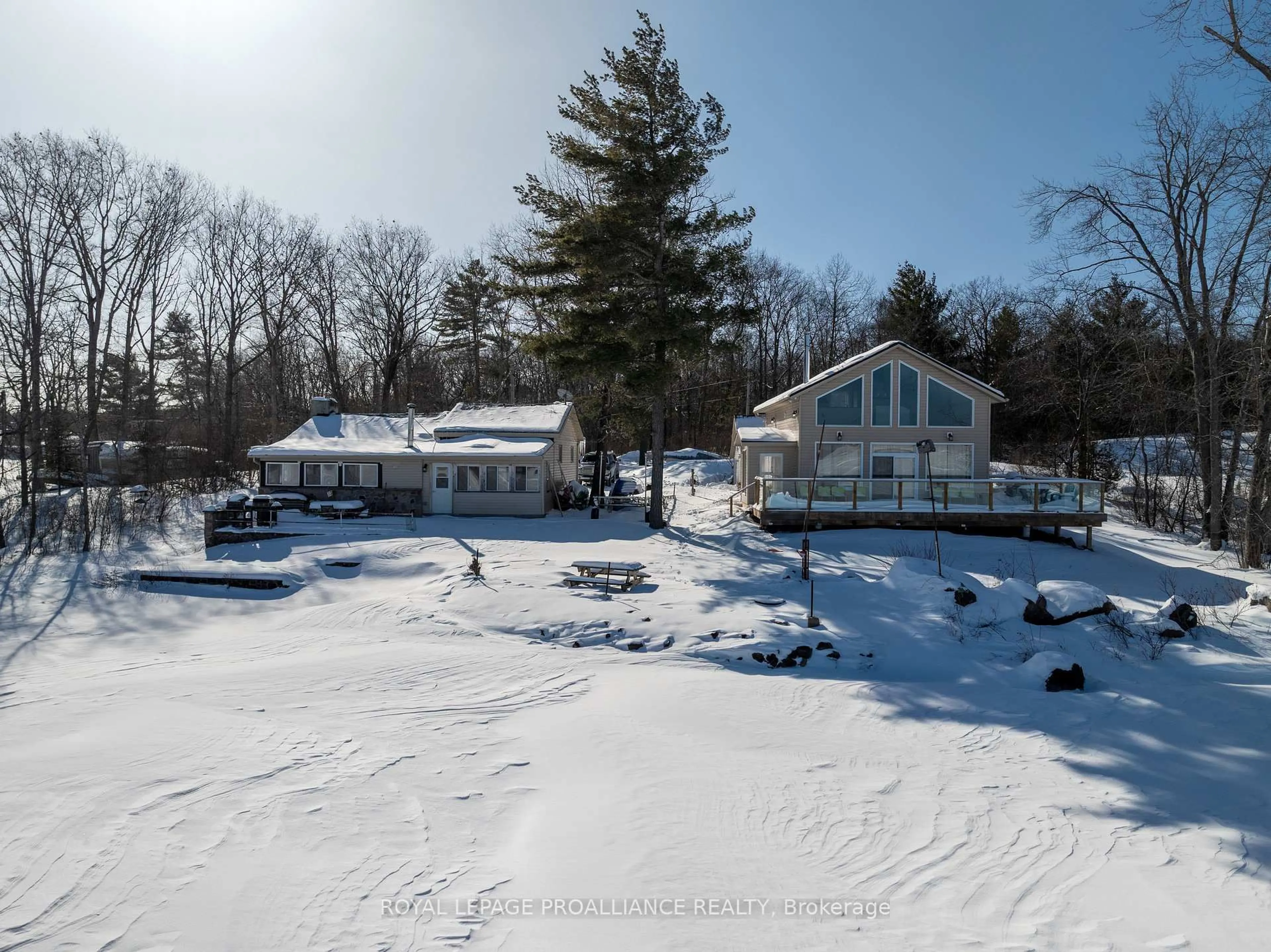 A pic from outside/outdoor area/front of a property/back of a property/a pic from drone, water/lake/river/ocean view for 75 Houston Lane, Tweed Ontario K0K 3J0