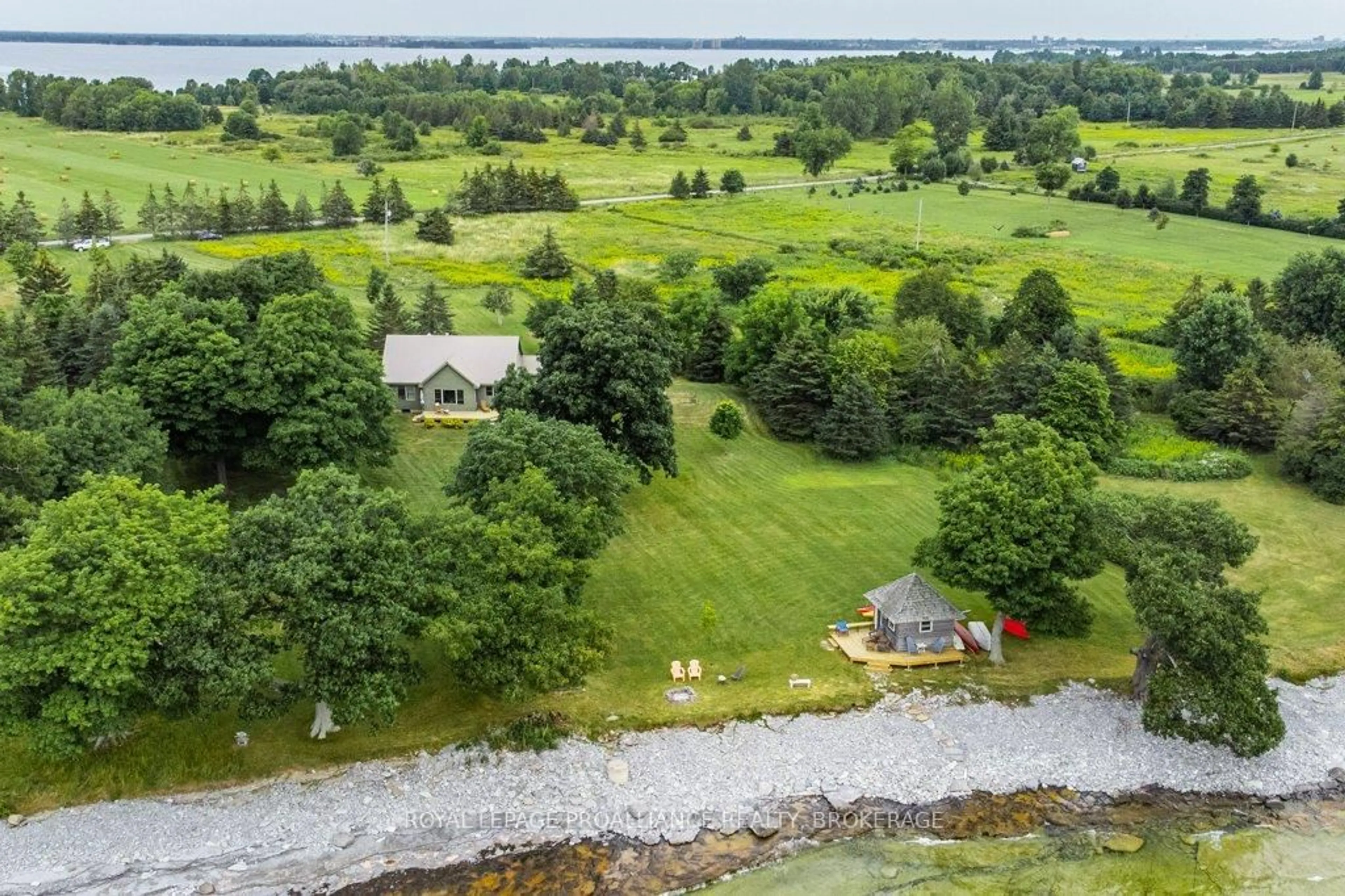 A pic from outside/outdoor area/front of a property/back of a property/a pic from drone, water/lake/river/ocean view for 395 Nine Mile Point Rd, Wolfe Island Ontario K0H 2Y0