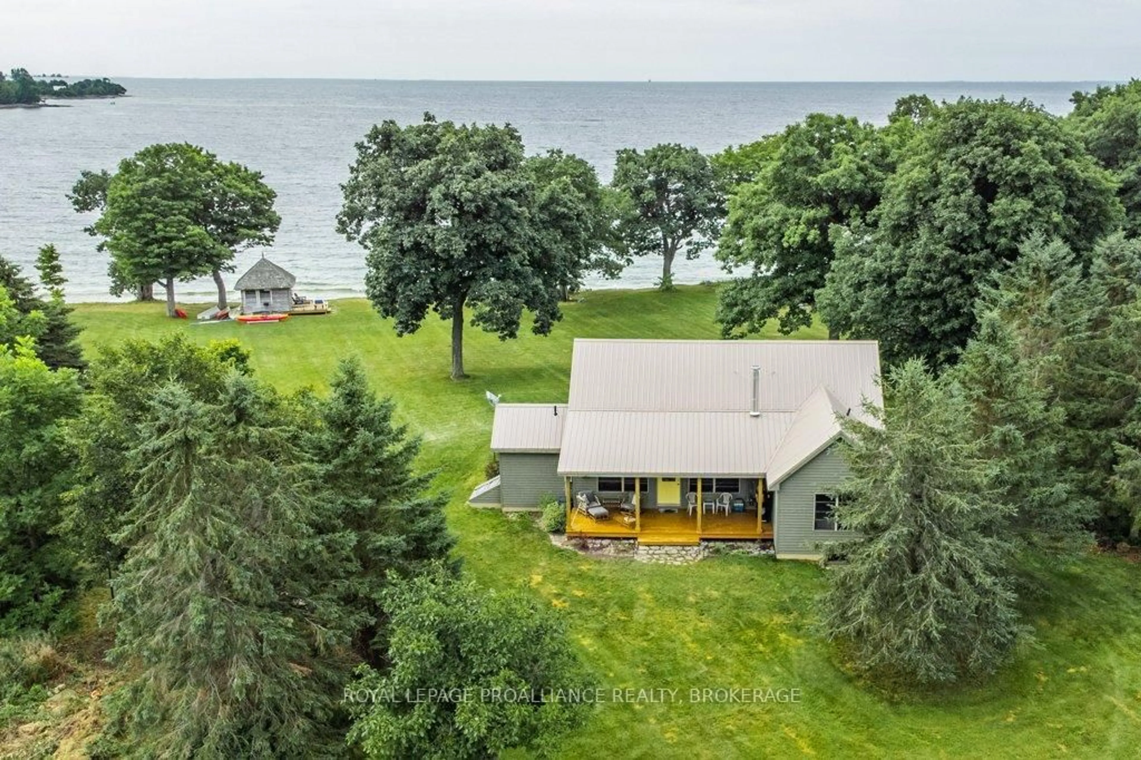 A pic from outside/outdoor area/front of a property/back of a property/a pic from drone, water/lake/river/ocean view for 395 Nine Mile Point Rd, Wolfe Island Ontario K0H 2Y0