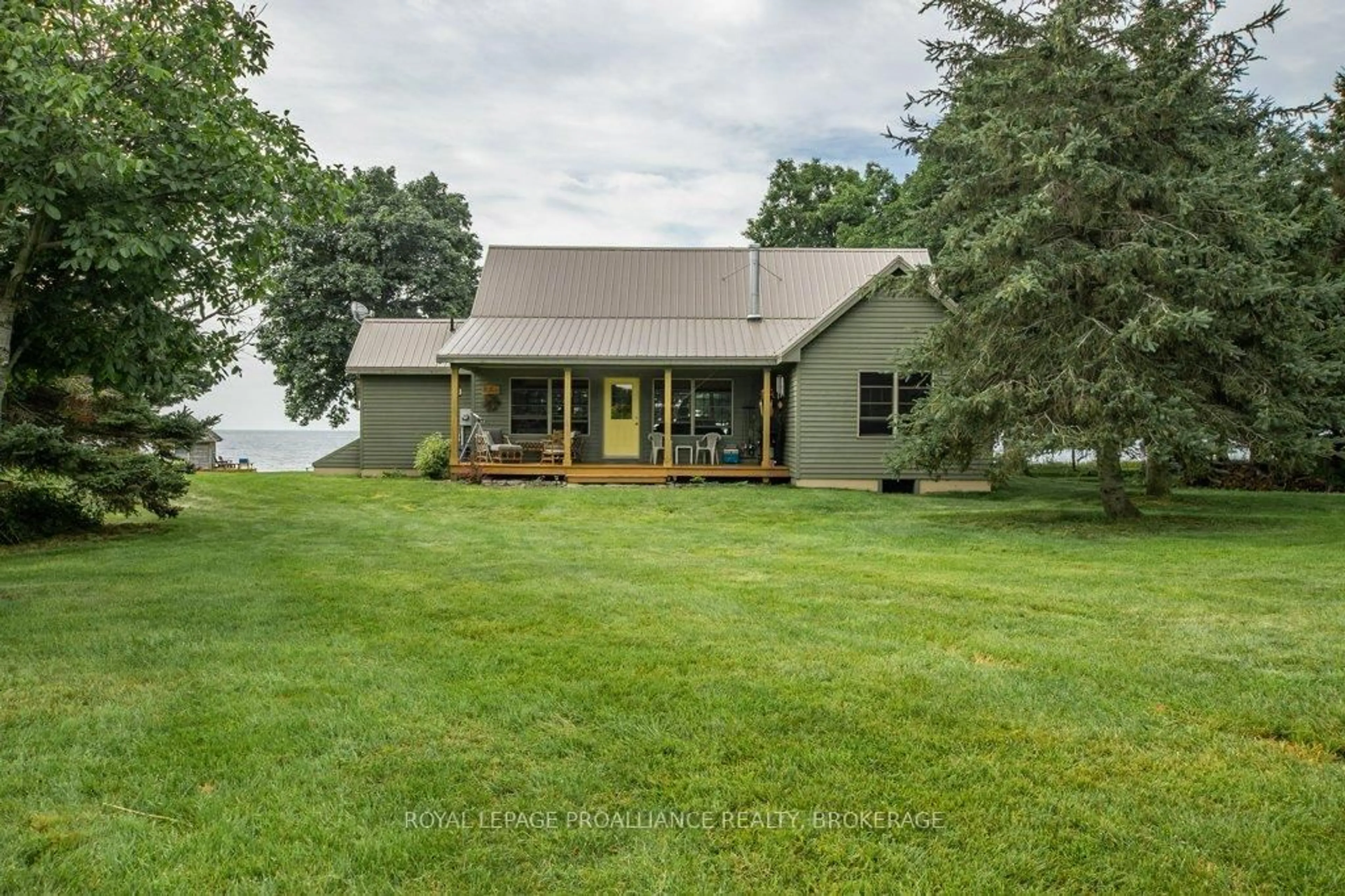 A pic from outside/outdoor area/front of a property/back of a property/a pic from drone, water/lake/river/ocean view for 395 Nine Mile Point Rd, Wolfe Island Ontario K0H 2Y0