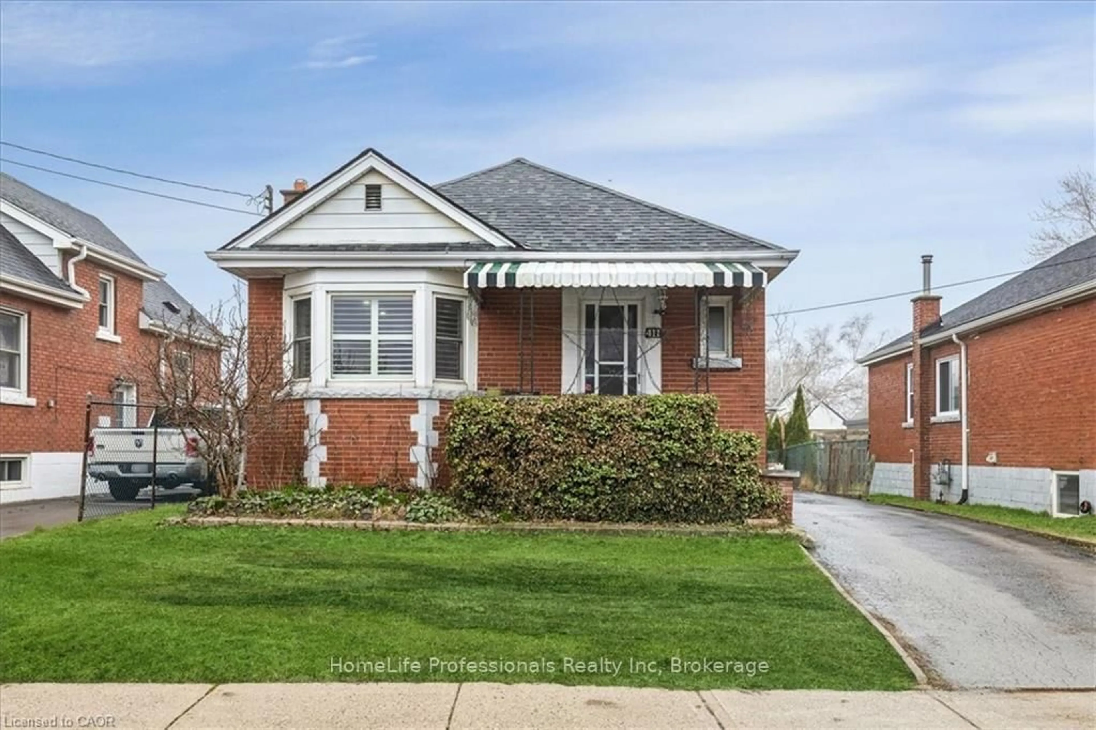 Home with brick exterior material, street for 411 UPPER GAGE Ave, Hamilton Ontario L8V 4H8