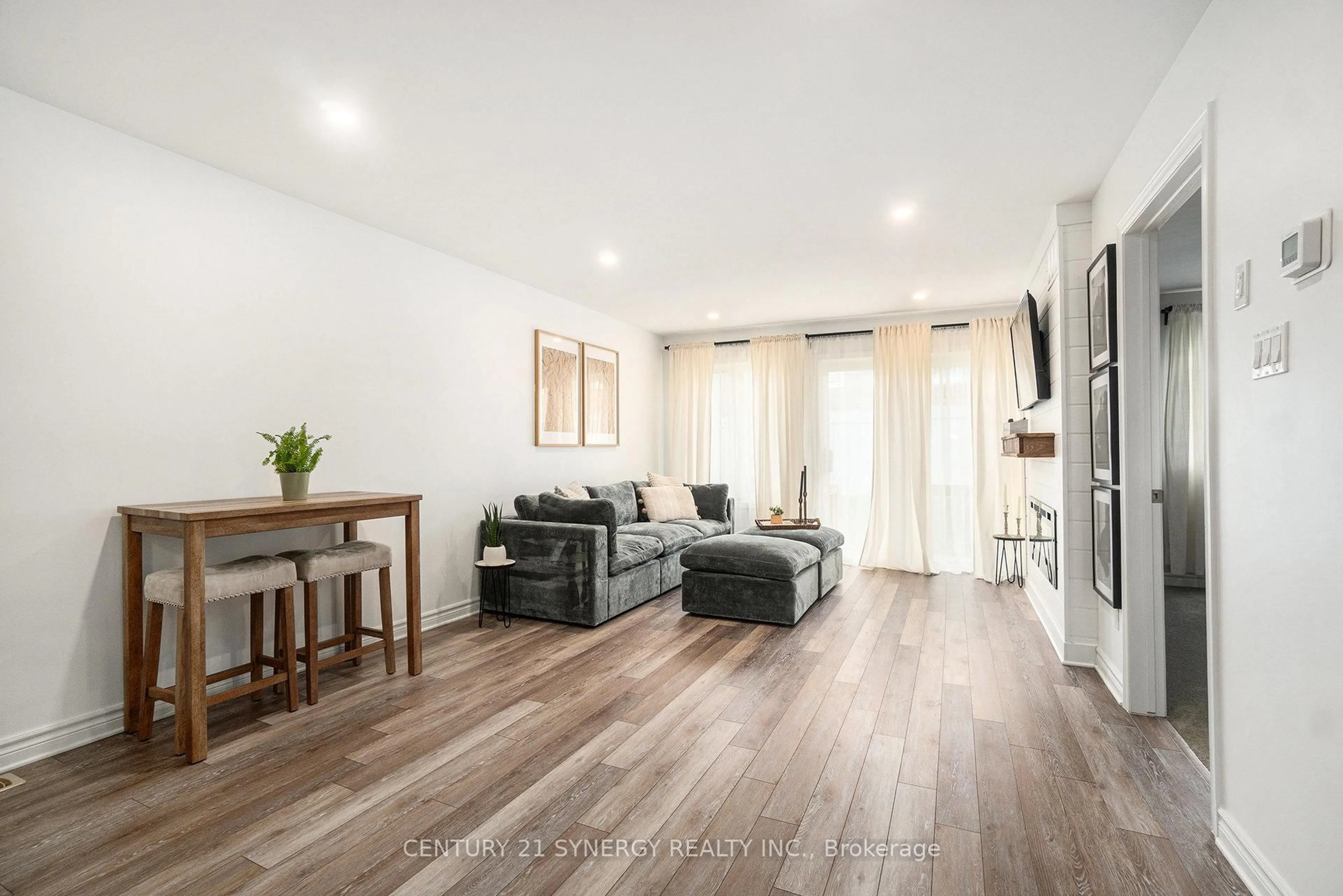 Living room with furniture, wood/laminate floor for 110 Seabert Dr, Arnprior Ontario K7S 0K1