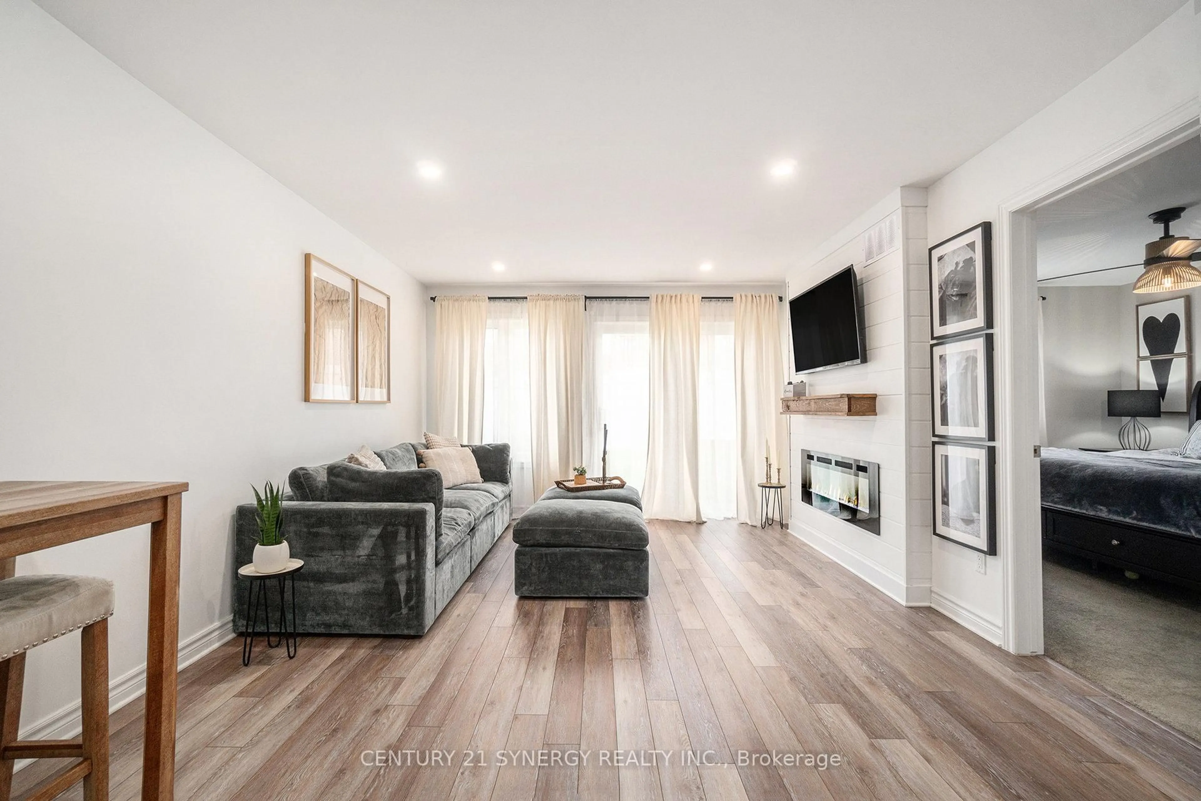 Living room with furniture, wood/laminate floor for 110 Seabert Dr, Arnprior Ontario K7S 0K1