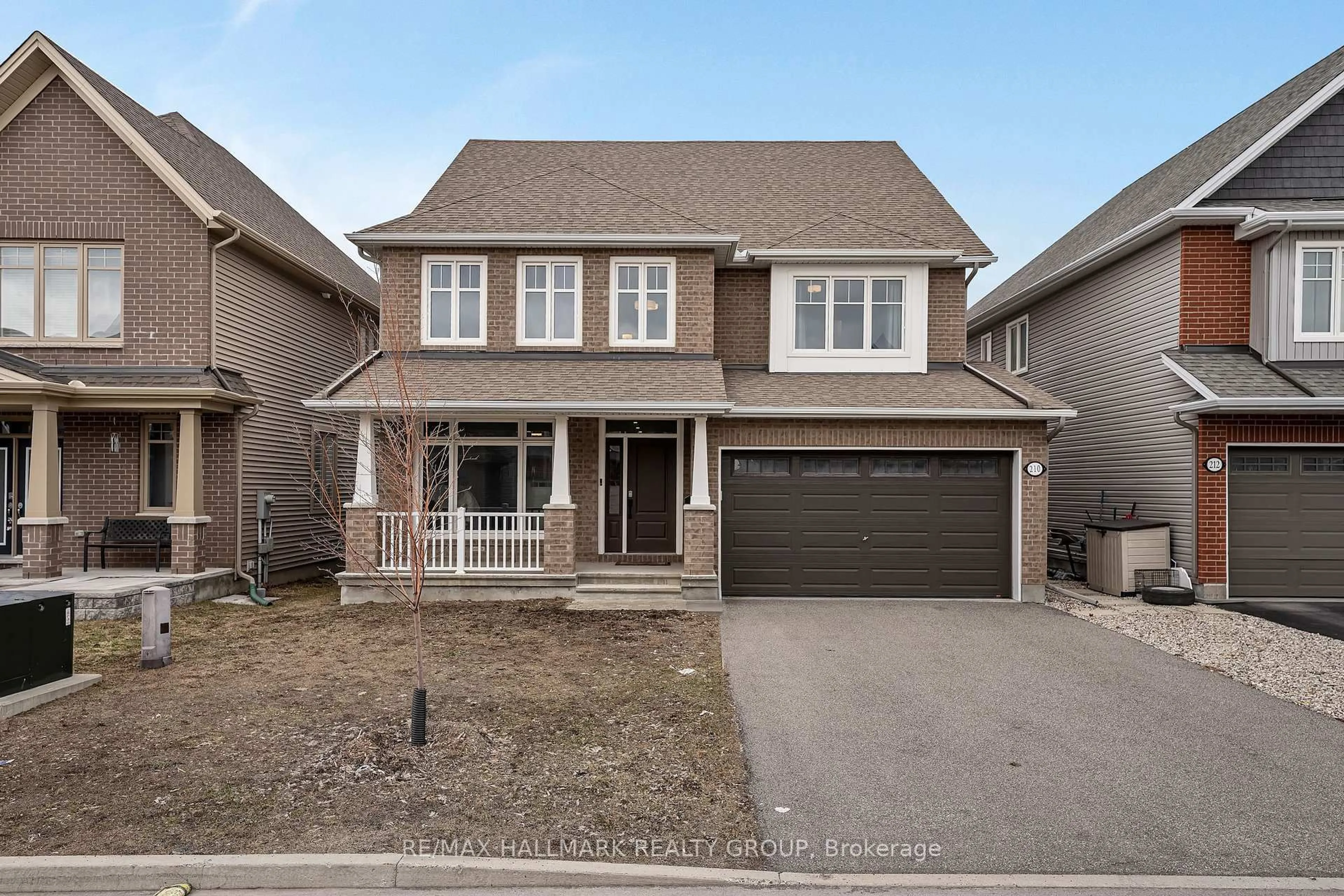 Home with brick exterior material, street for 210 Trollius Way, Ottawa Ontario K1T 0R7