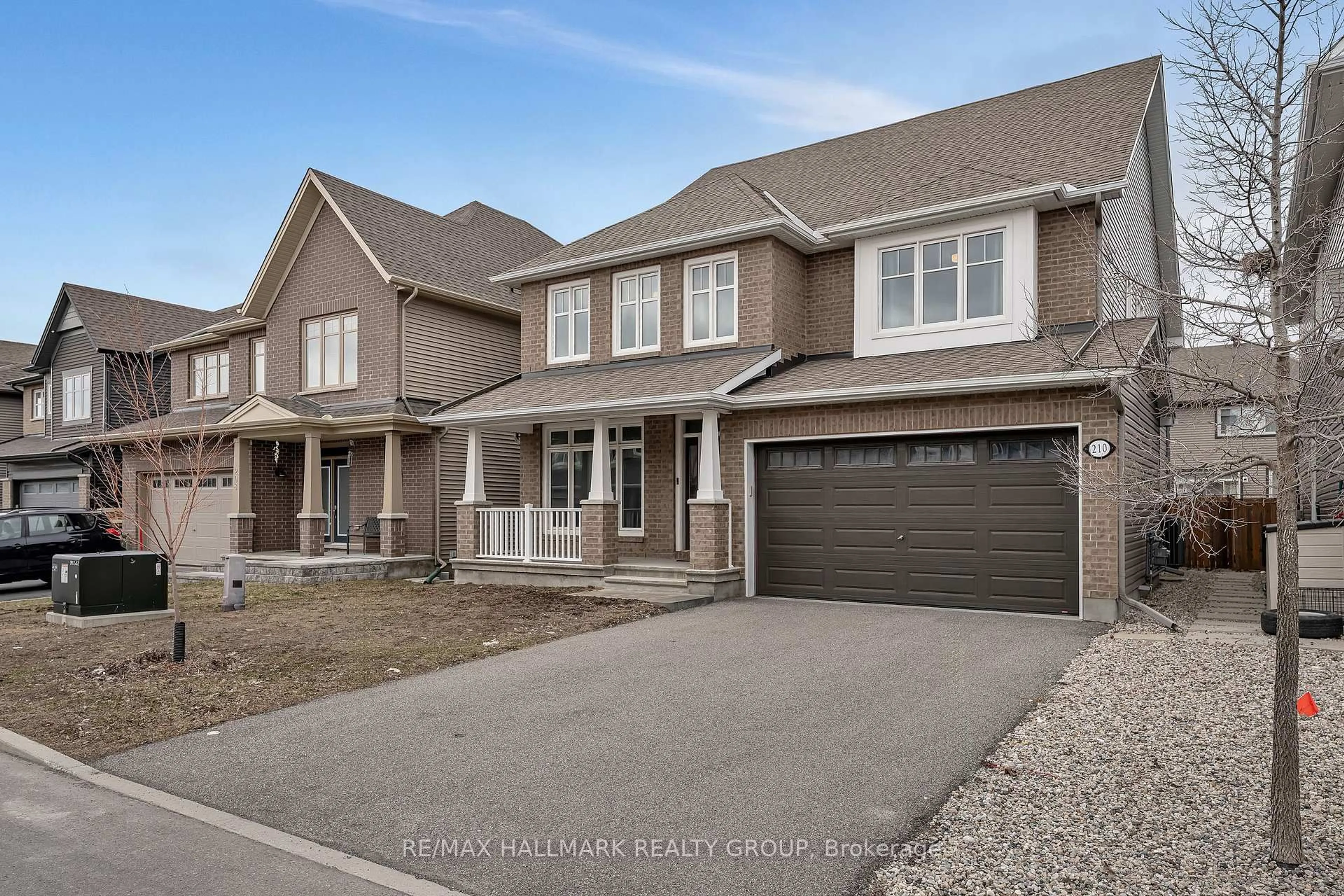 Home with brick exterior material, street for 210 Trollius Way, Ottawa Ontario K1T 0R7