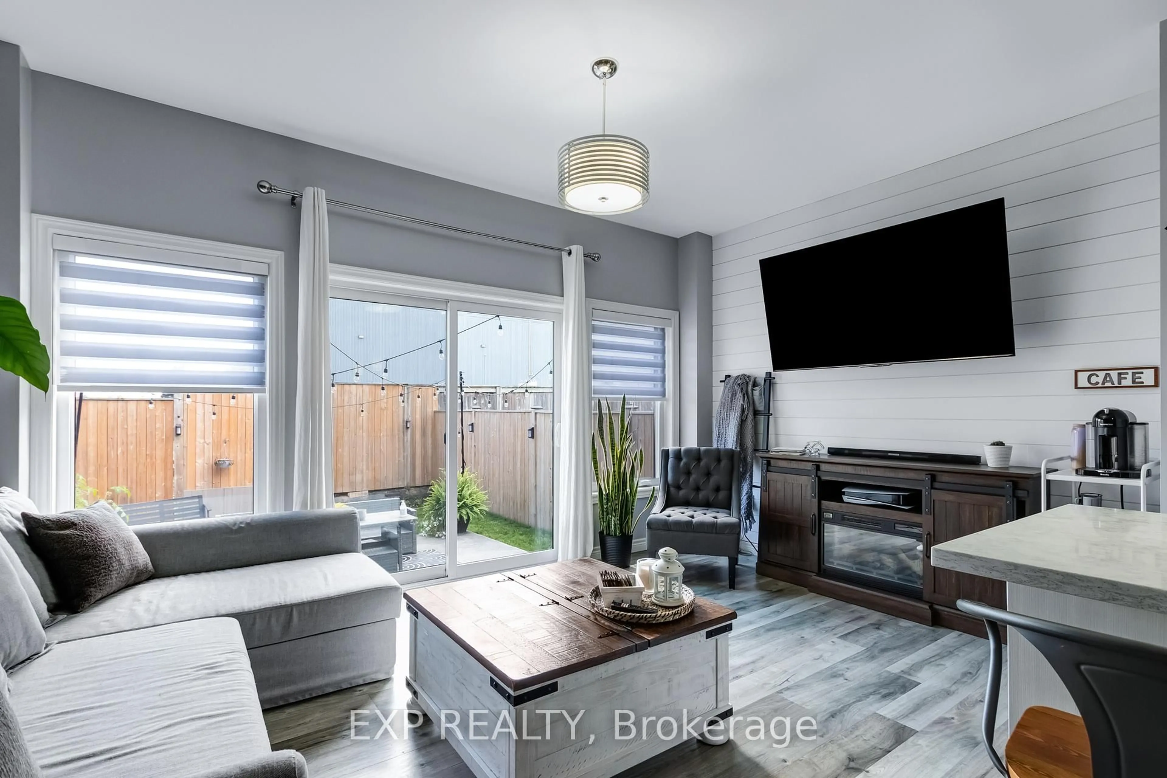 Living room with furniture, wood/laminate floor for 688 Dunn Ave, Hamilton Ontario L8H 6M6