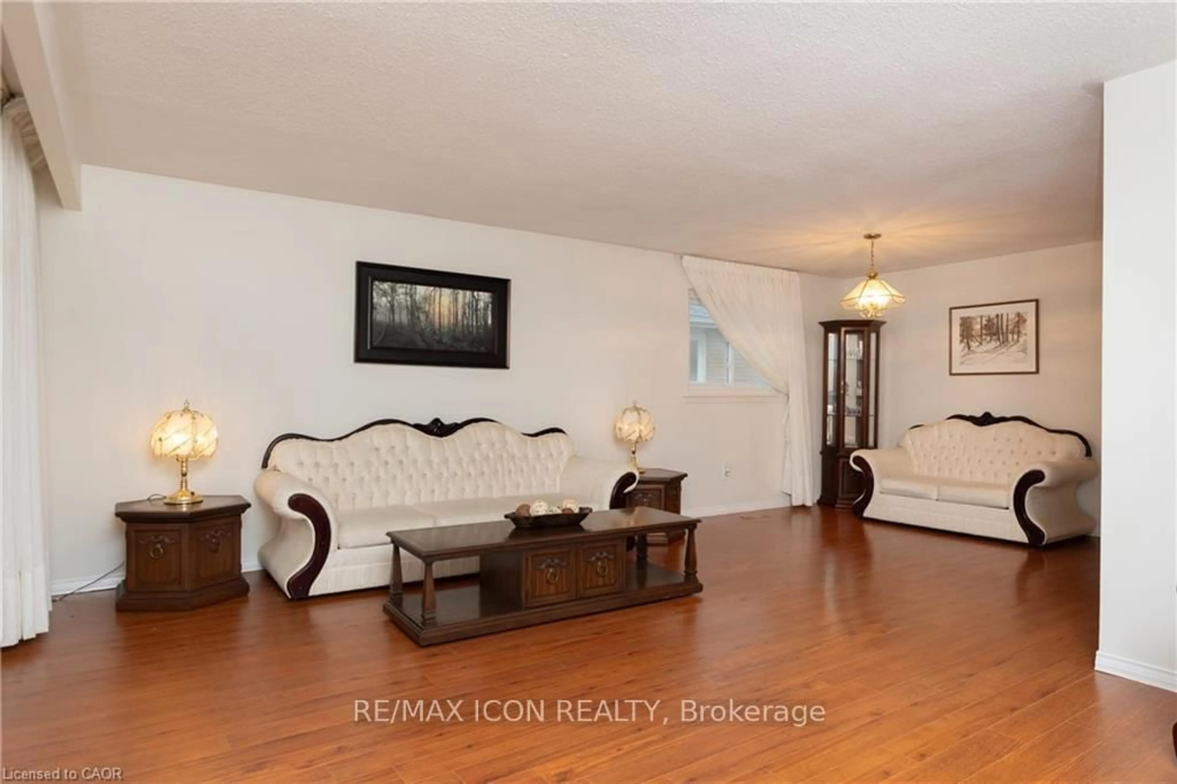 Living room with furniture, wood/laminate floor for 227 Hazelglen Dr, Kitchener Ontario N2M 2E6