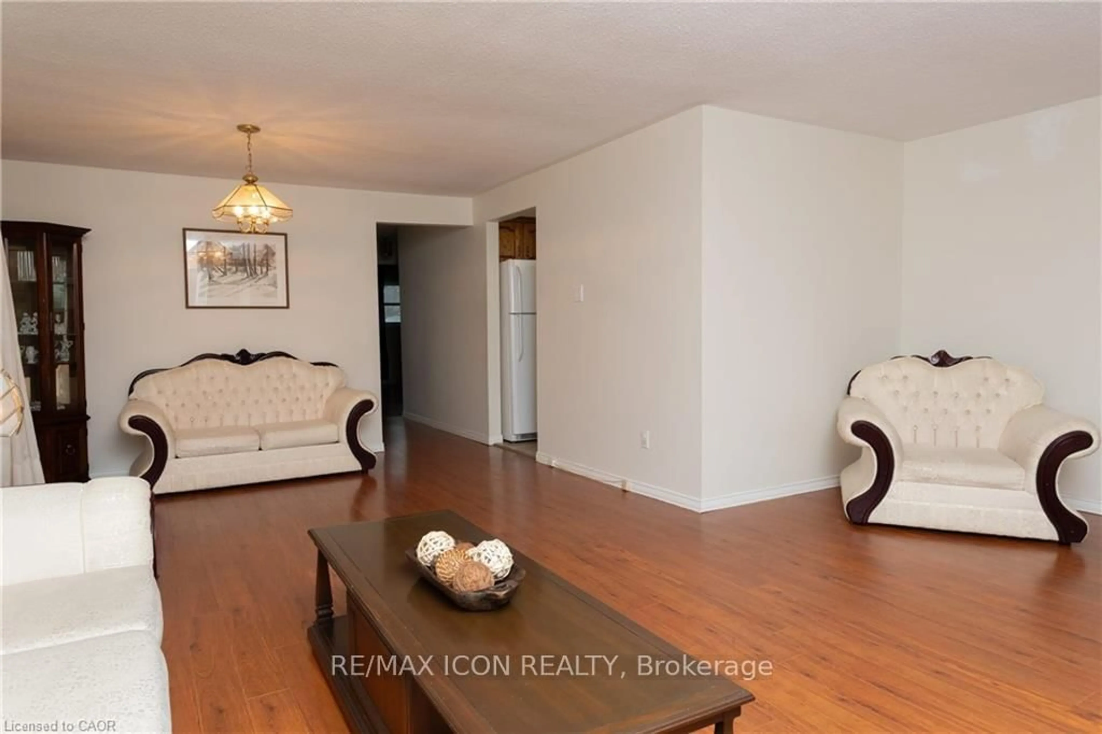 Living room with furniture, wood/laminate floor for 227 Hazelglen Dr, Kitchener Ontario N2M 2E6