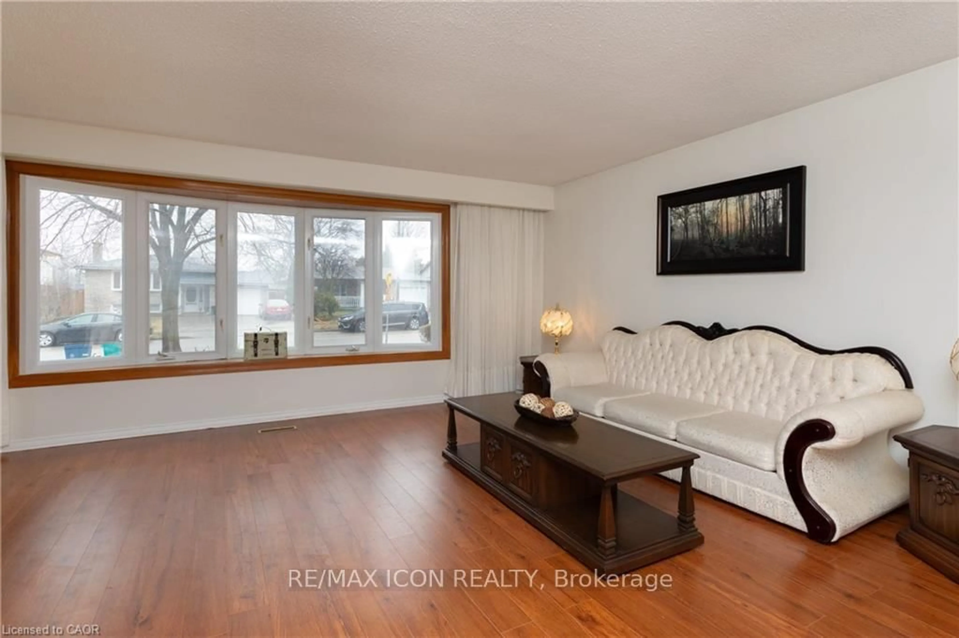 Living room with furniture, wood/laminate floor for 227 Hazelglen Dr, Kitchener Ontario N2M 2E6