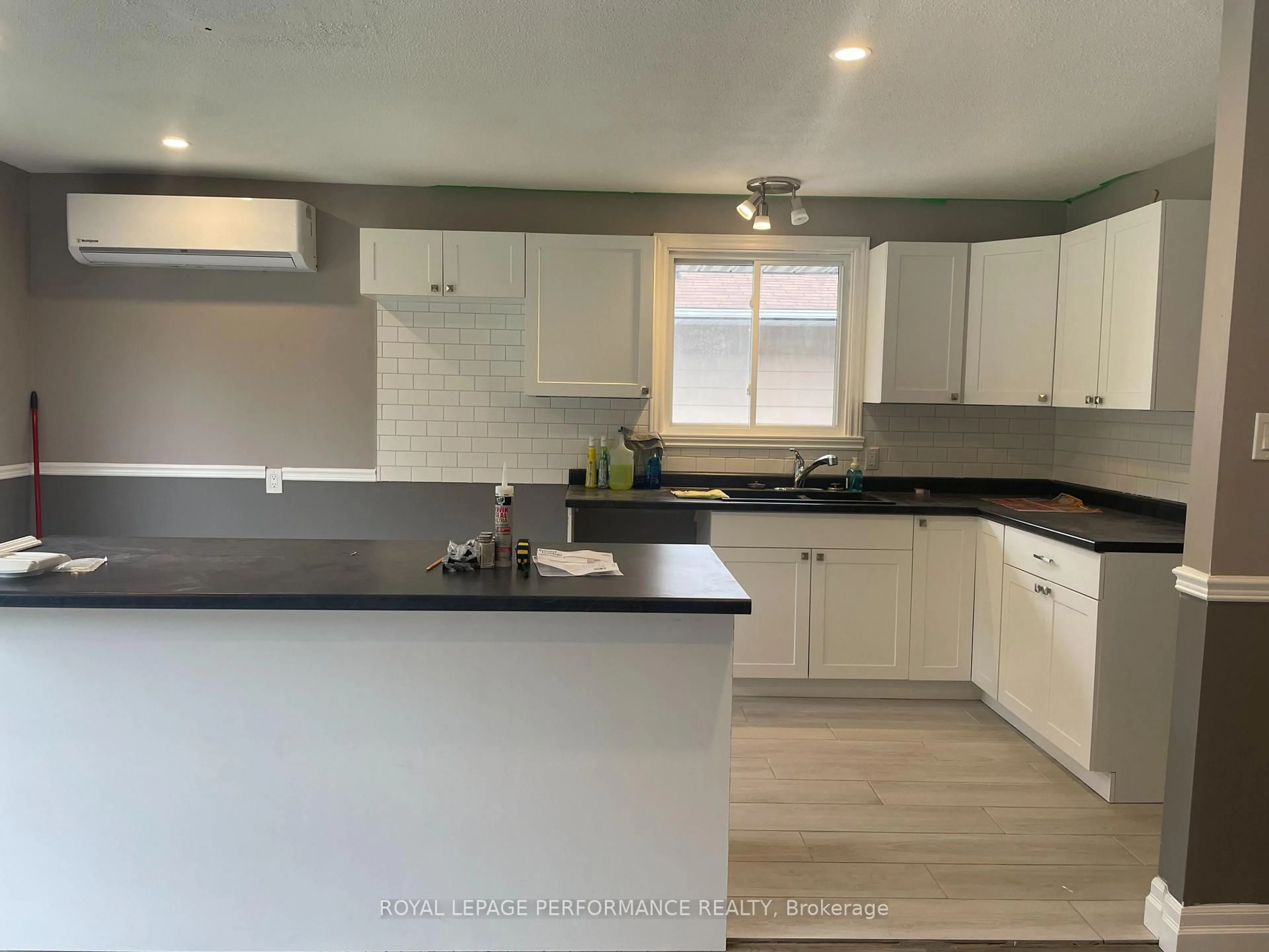 Open concept kitchen, wood/laminate floor for 624 Dundas Cres, Cornwall Ontario K6H 6H8