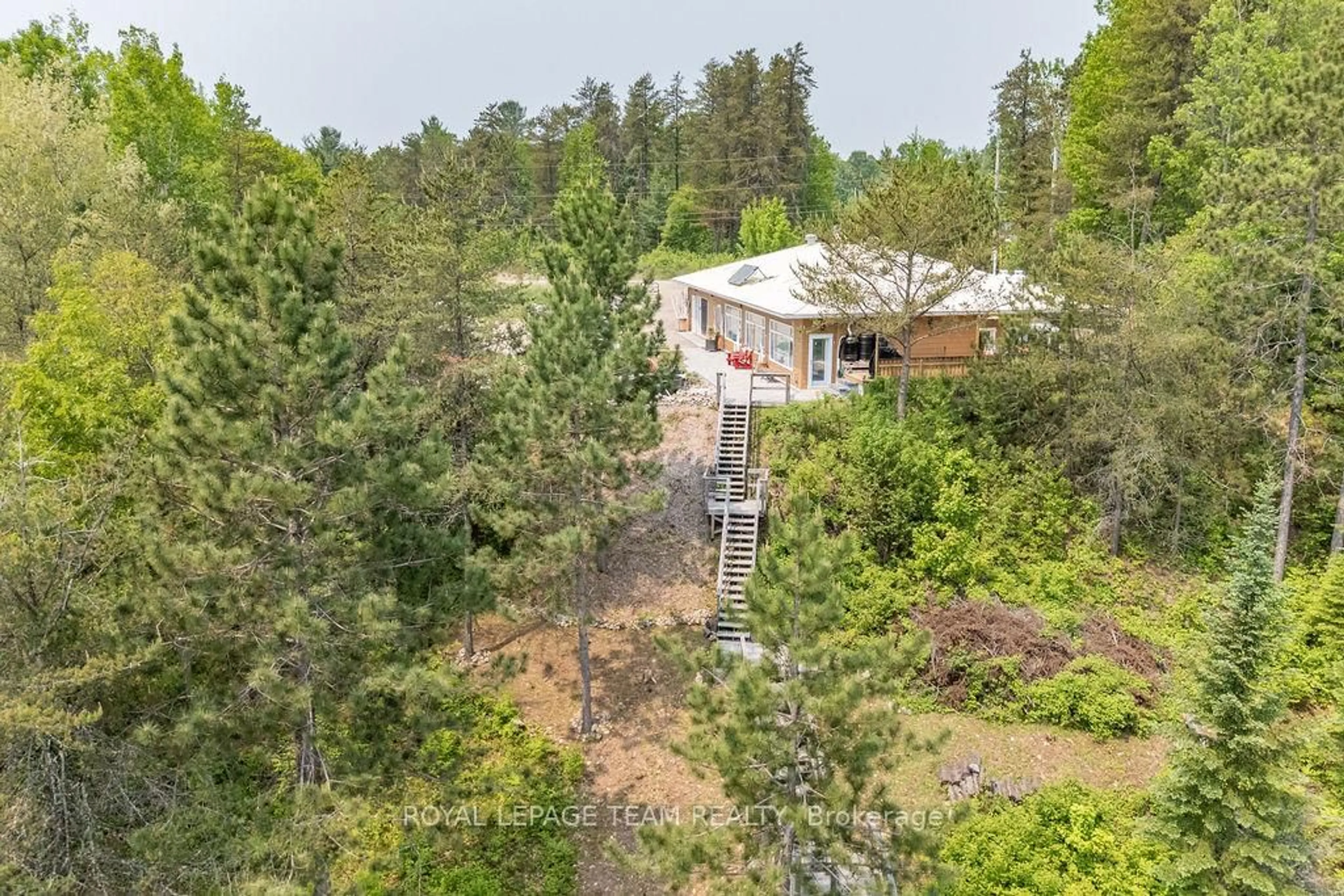 A pic from outside/outdoor area/front of a property/back of a property/a pic from drone, forest/trees view for 188 Paugh Lake Rd, Barry's Bay Ontario K0J 1B0