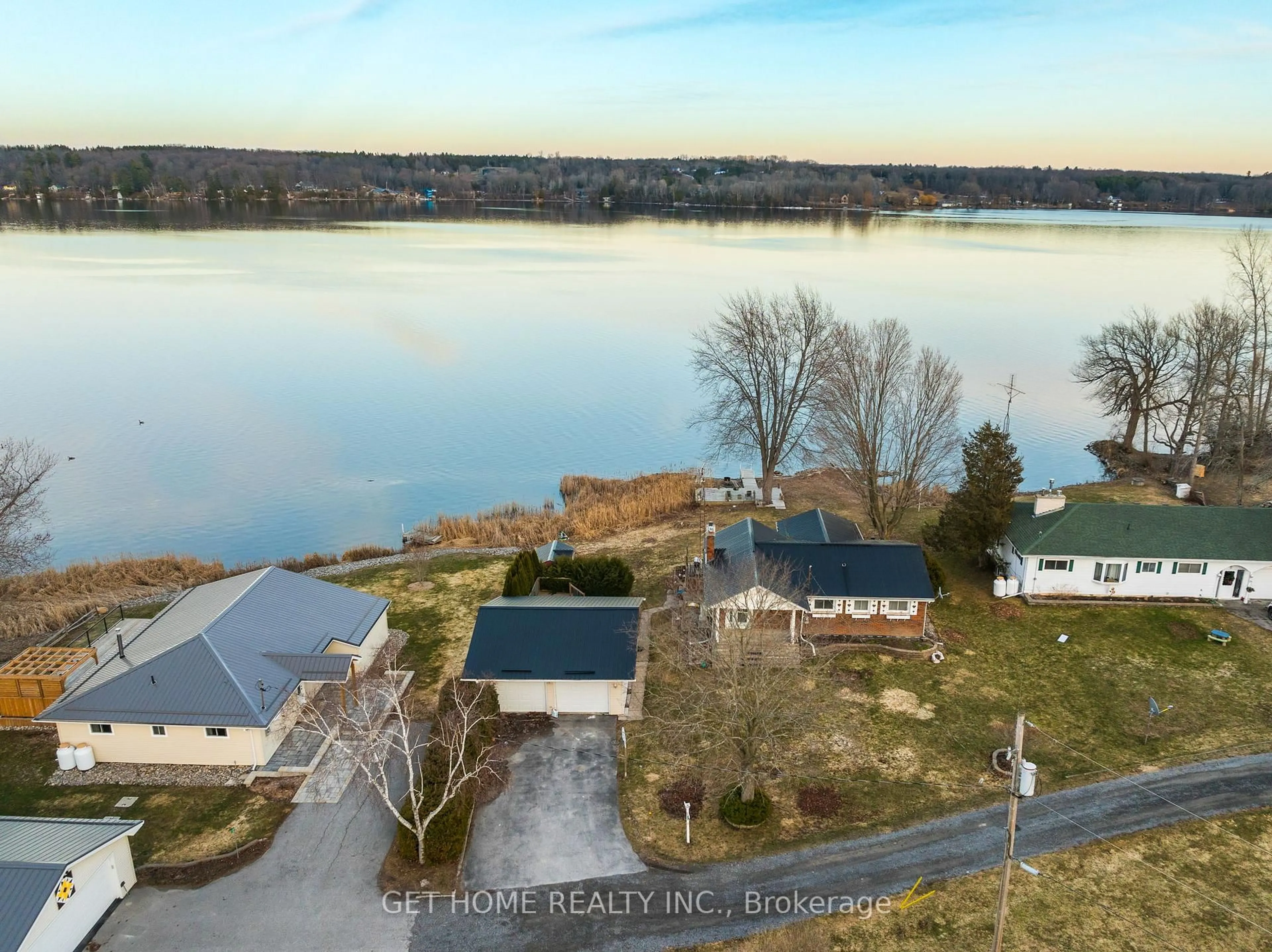 A pic from outside/outdoor area/front of a property/back of a property/a pic from drone, water/lake/river/ocean view for 52 Pats Lane, Prince Edward County Ontario K0K 2T0