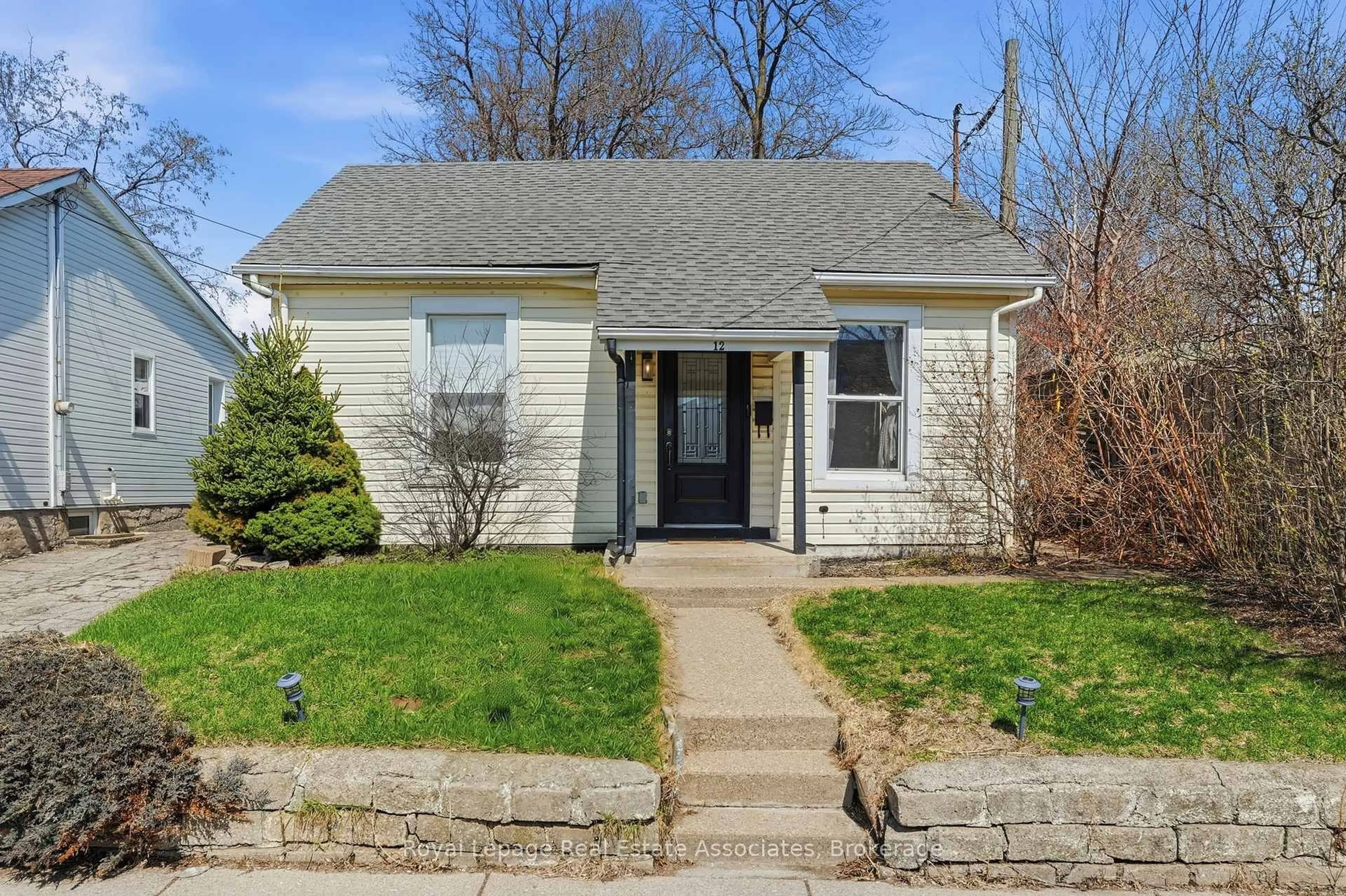 Home with vinyl exterior material, street for 12 Nelson St, Hamilton Ontario L8P 1G3