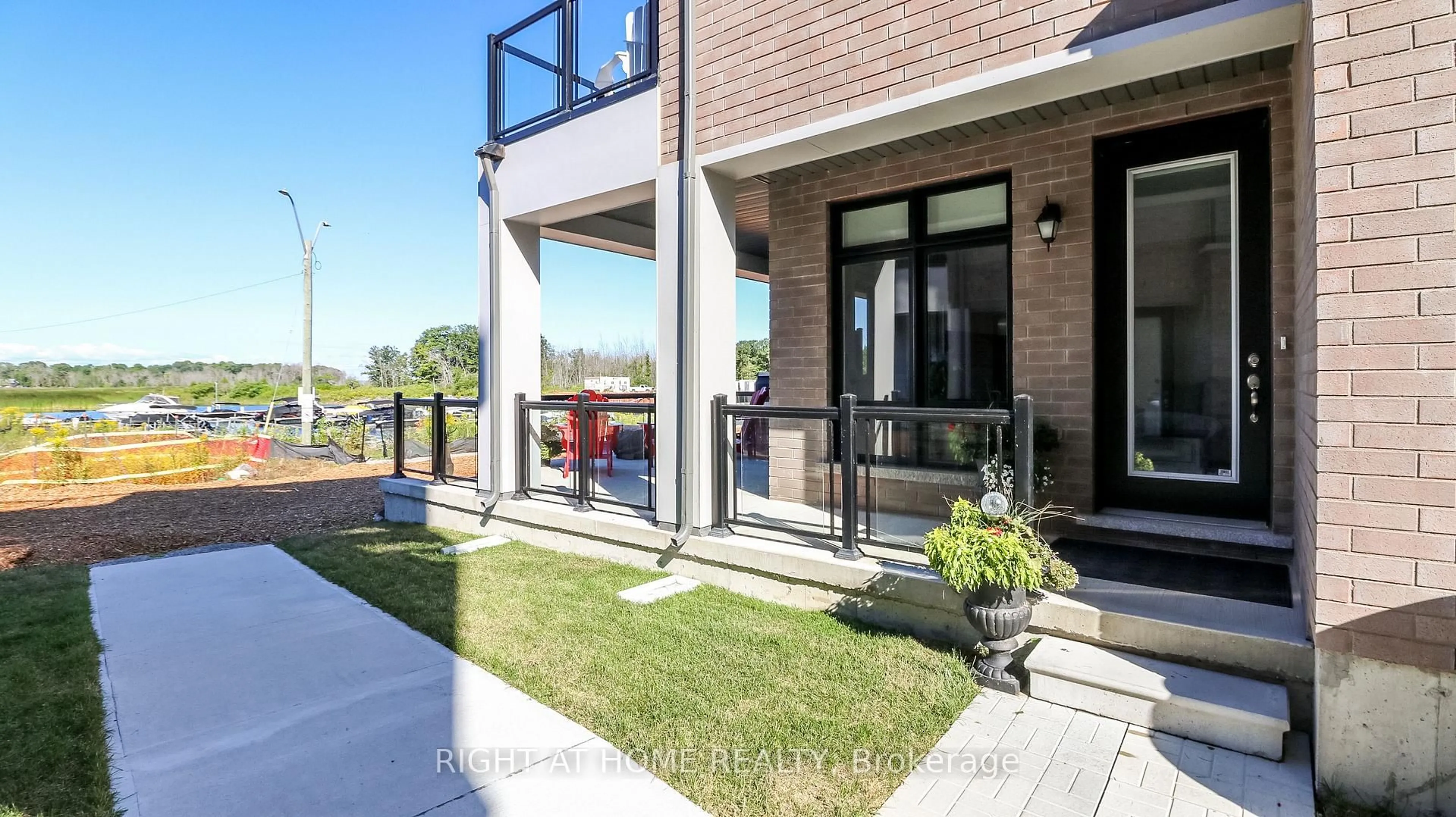 Home with brick exterior material, street for 100 Marina Village Dr, Georgian Bay Ontario L0K 1S0