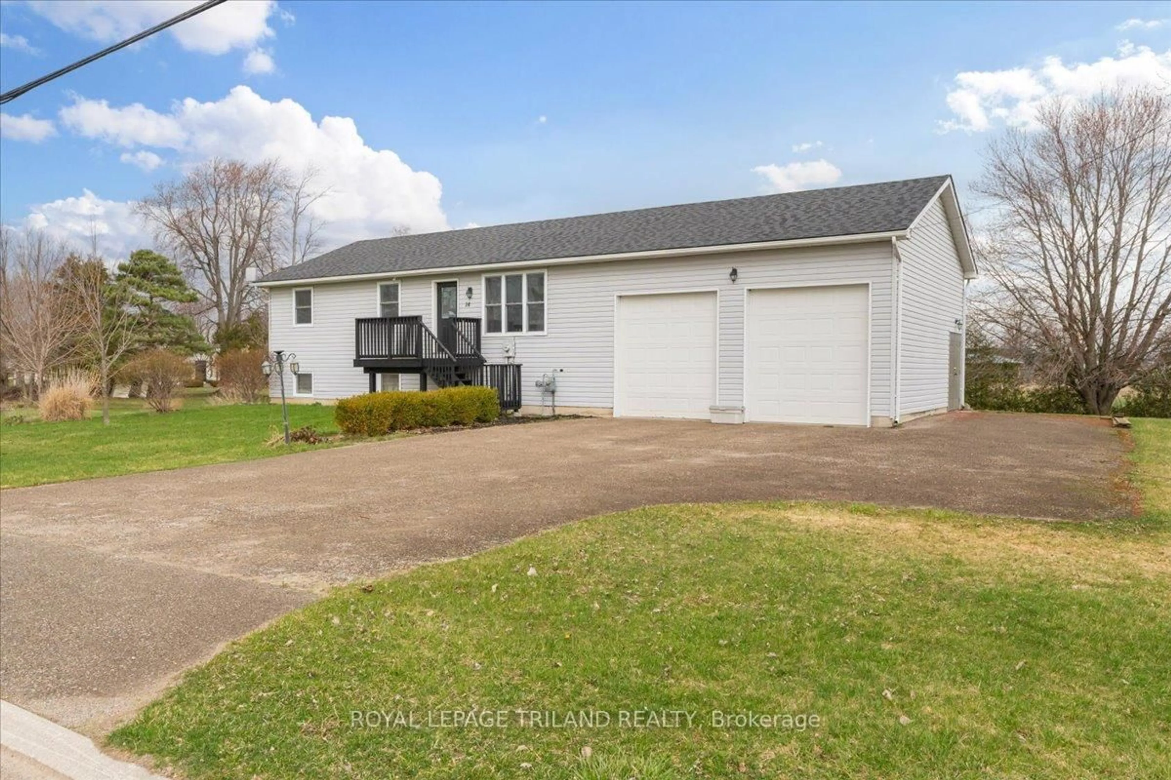 Home with vinyl exterior material, street for 14 Wellington Ave, Southwest Middlesex Ontario N0L 1A0