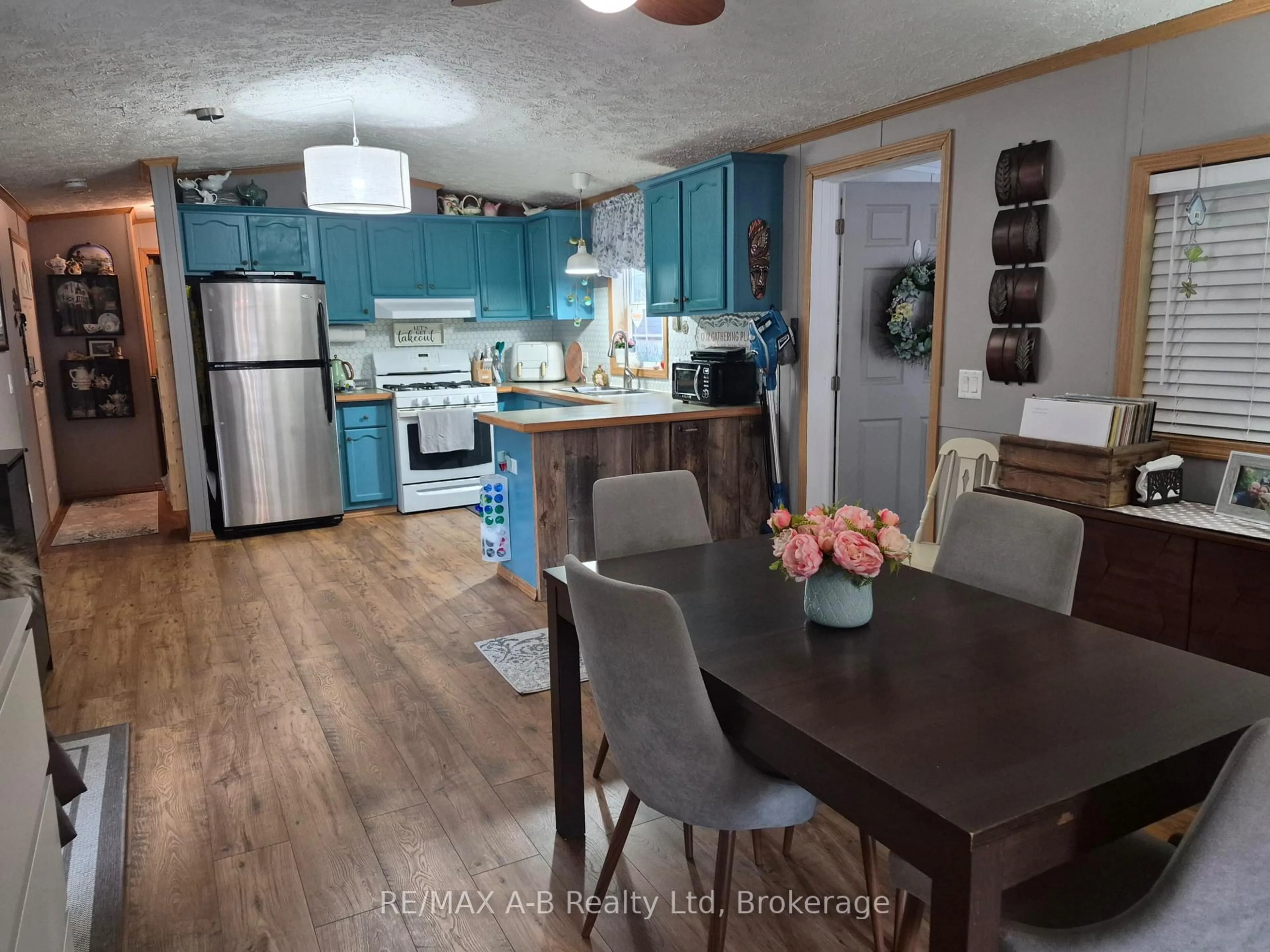 Open concept kitchen, wood/laminate floor for 923590 Road 92 Rd #411, Zorra Ontario N0J 1J0