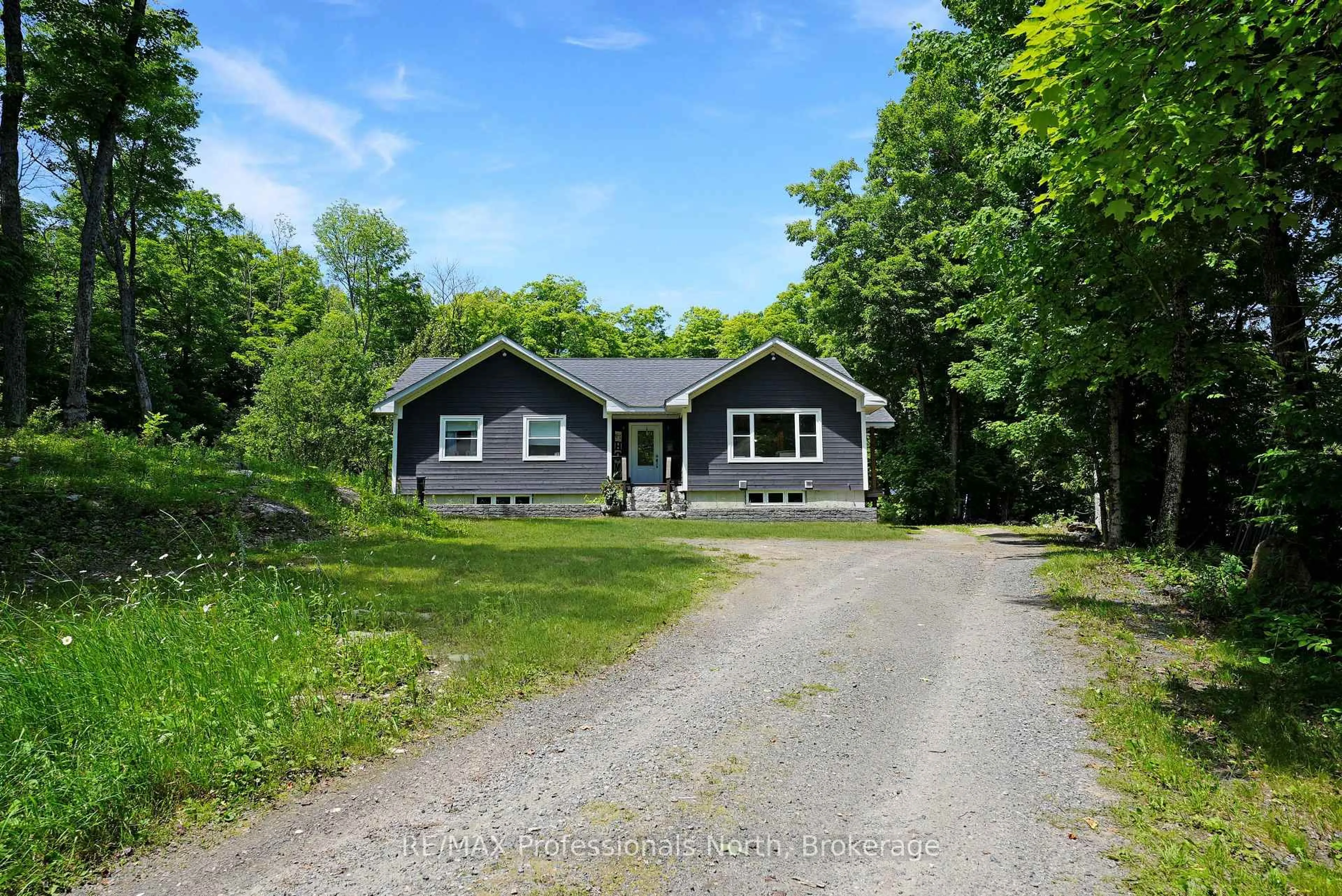 A pic from outside/outdoor area/front of a property/back of a property/a pic from drone, street for 1979 Blairhampton Rd, Minden Hills Ontario K0M 2K0