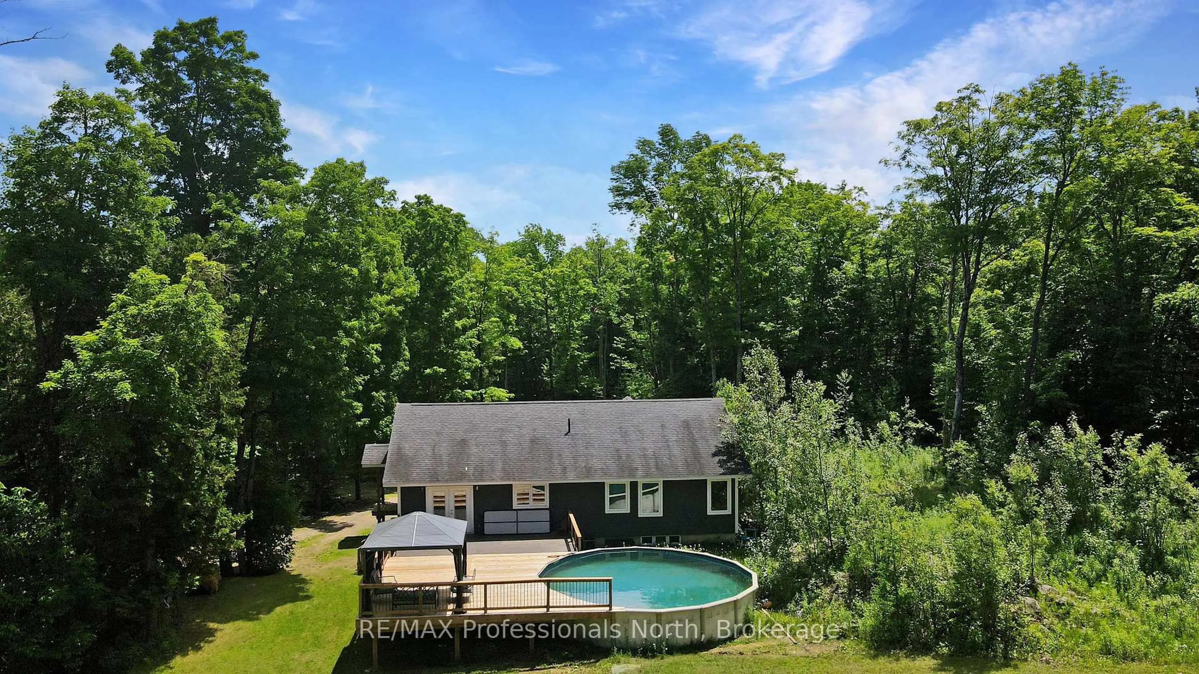 A pic from outside/outdoor area/front of a property/back of a property/a pic from drone, water/lake/river/ocean view for 1979 Blairhampton Rd, Minden Hills Ontario K0M 2K0