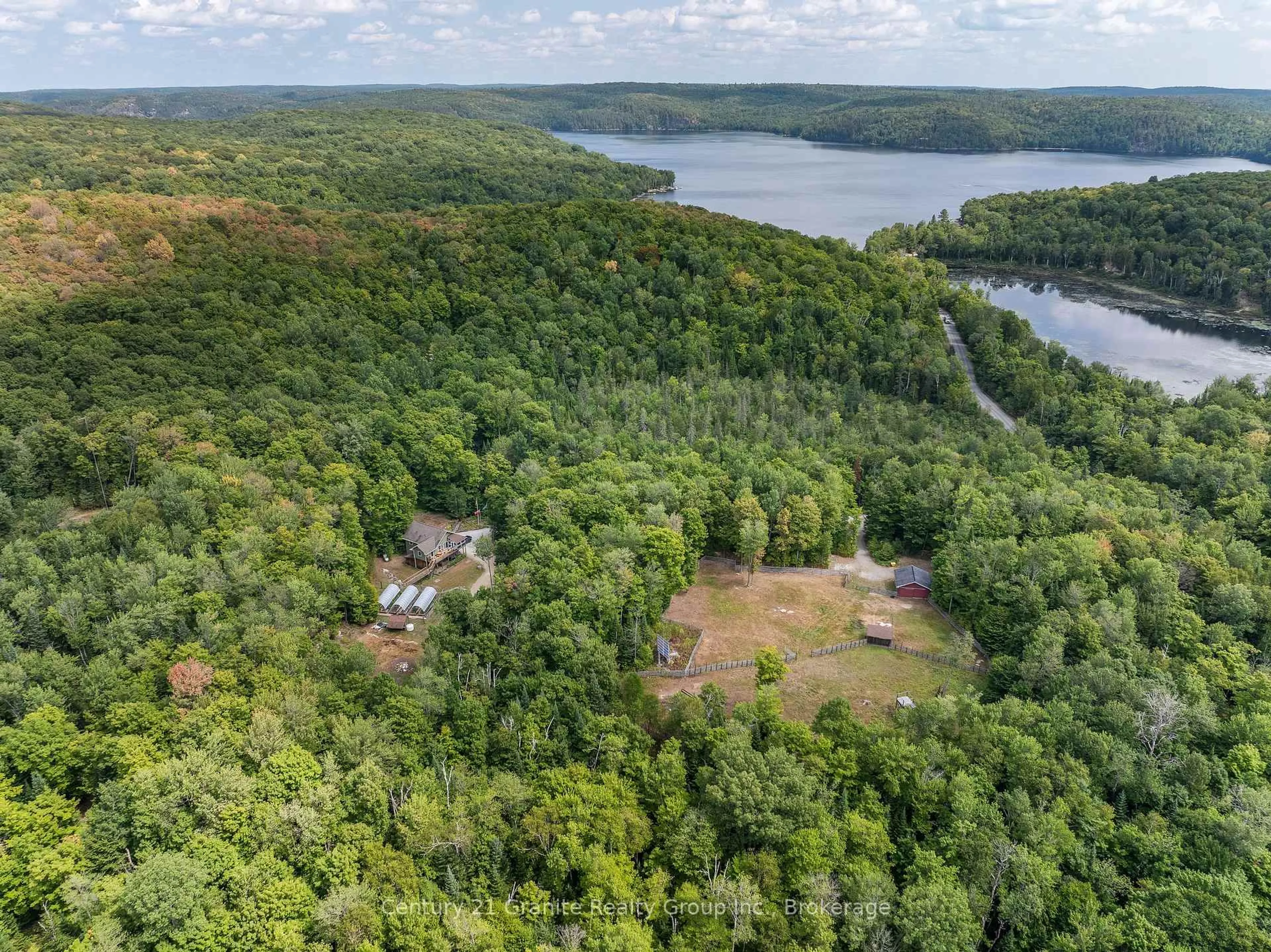 A pic from outside/outdoor area/front of a property/back of a property/a pic from drone, water/lake/river/ocean view for 1071 Dardanelles Rd, Dysart et al Ontario K0M 1S0